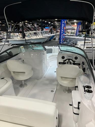 2024 SouthWind 2400 SD boat interior with white seating and dashboard.