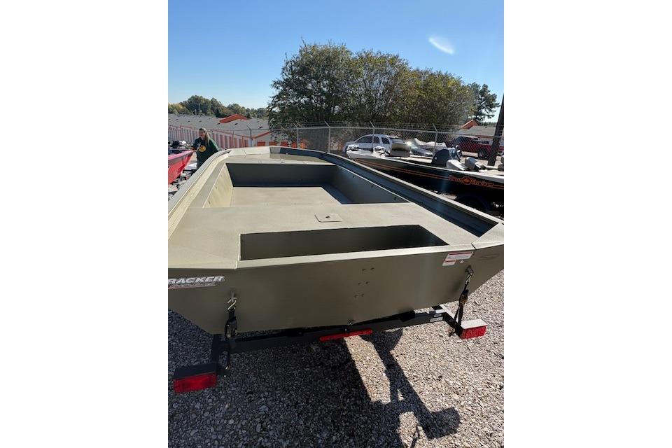 2026 Tracker Grizzly 1860 Utility boat on trailer in outdoor setting.