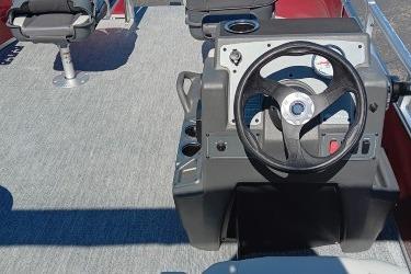 2026 Sun Tracker Bass Buggy 16 XL Select pontoon boat interior with steering console.