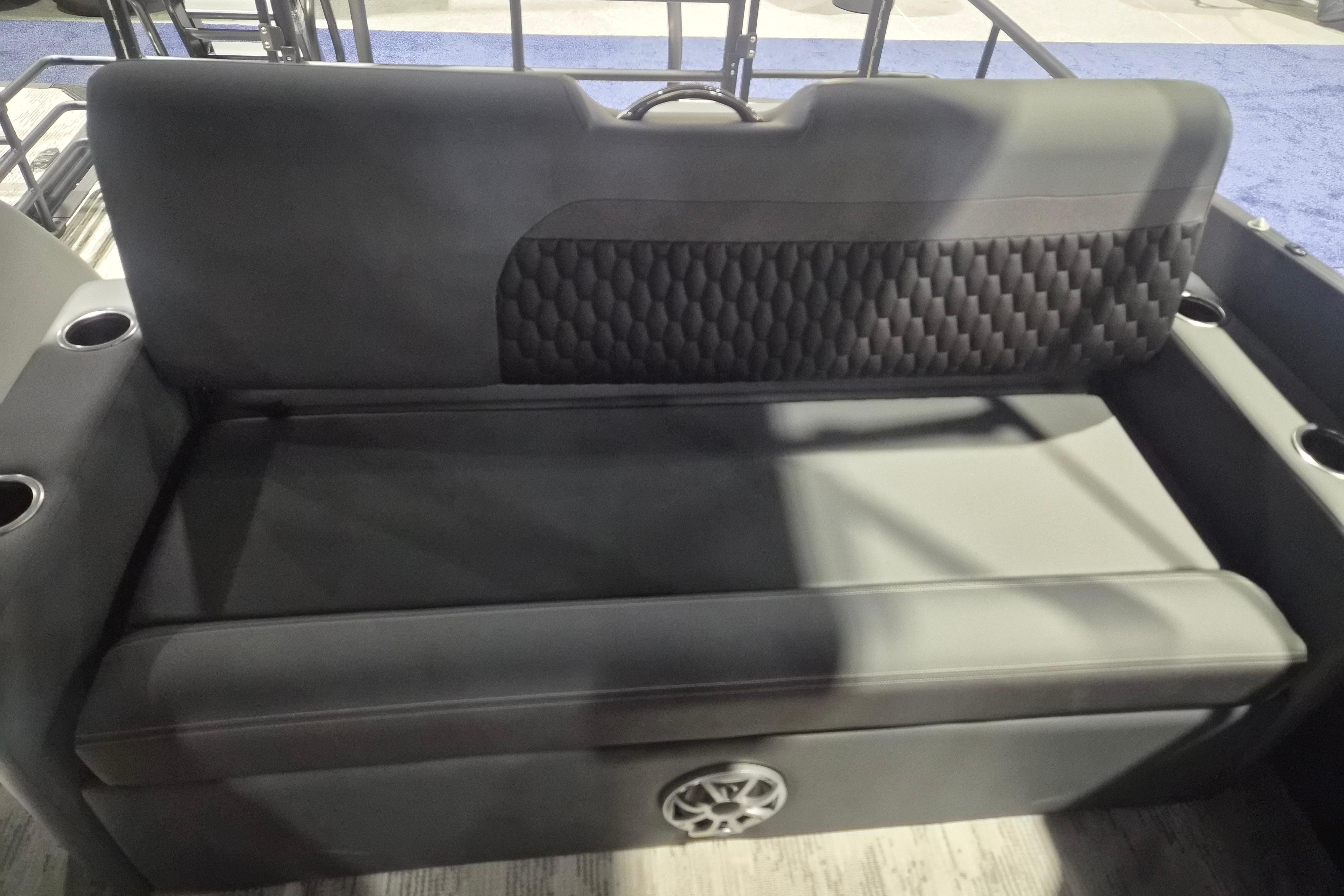 Luxurious seating in the 2026 Sylvan L3 ULZ boat, featuring cup holders and stylish upholstery.