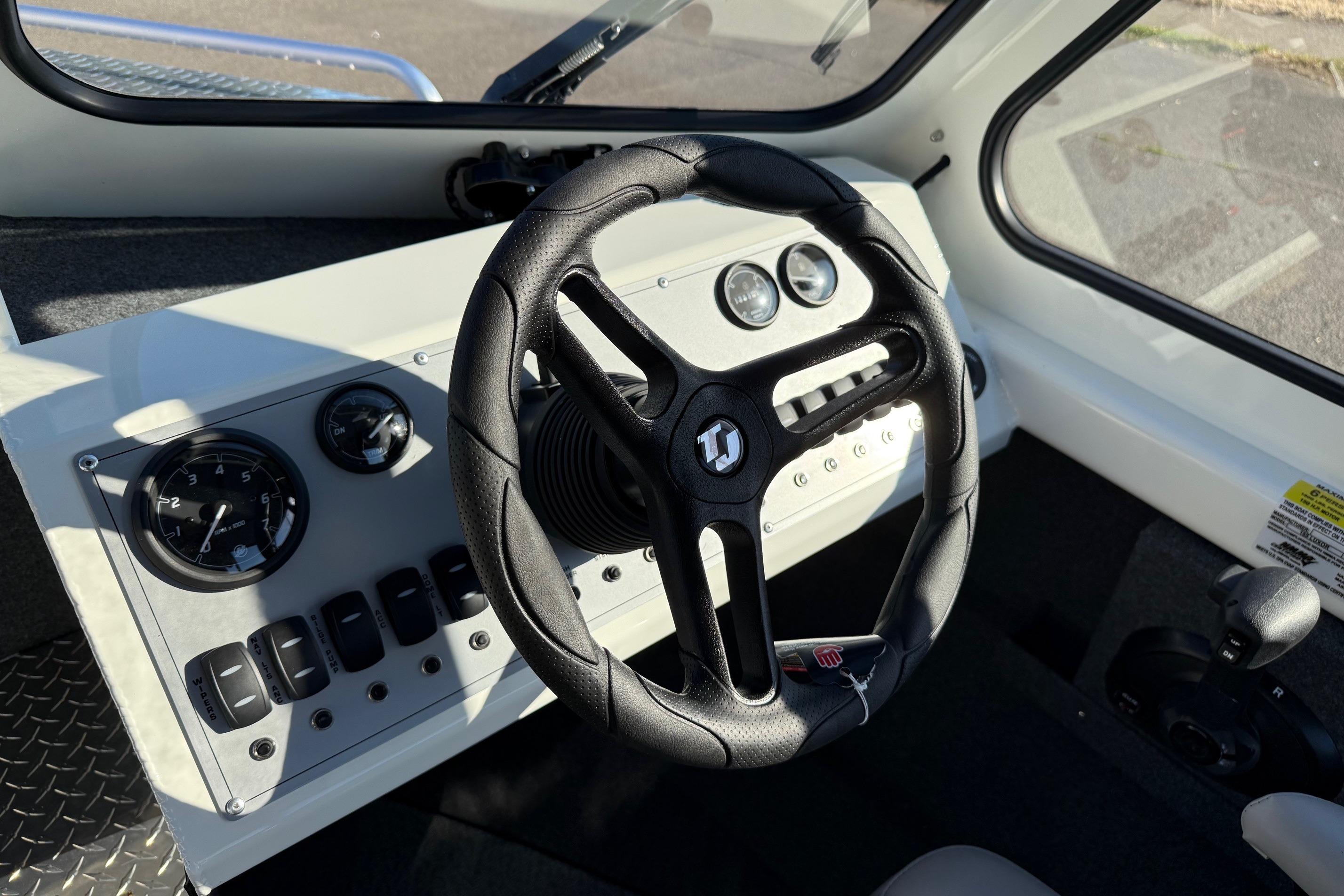 2026 Thunder Jet 185 Luxor boat dashboard with steering wheel and control panel.
