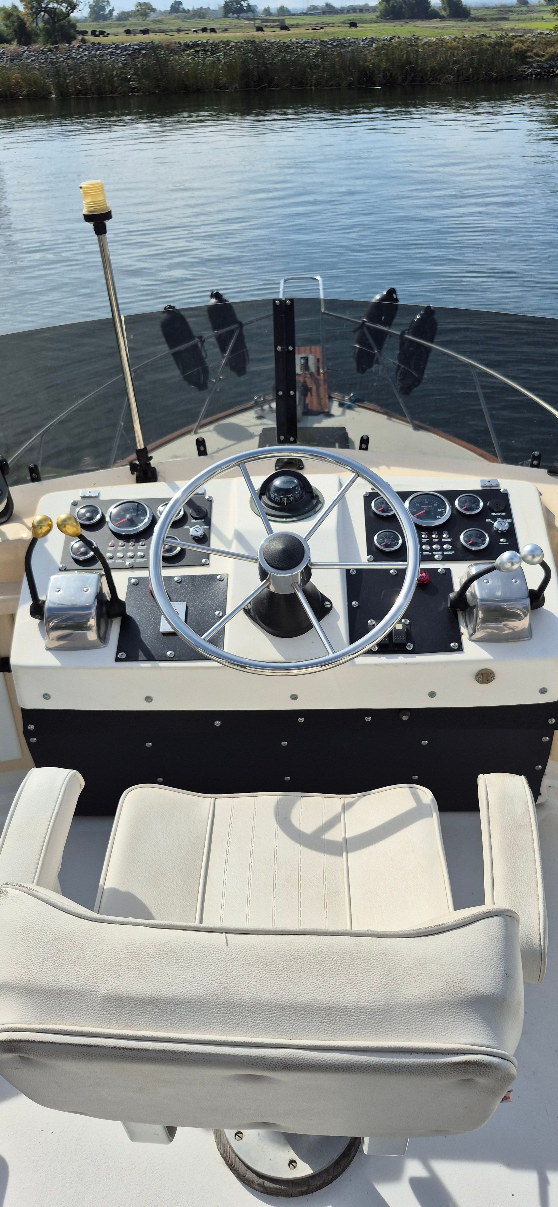 Helm of a 1976 Egg Harbor 33 Sportfisher boat.