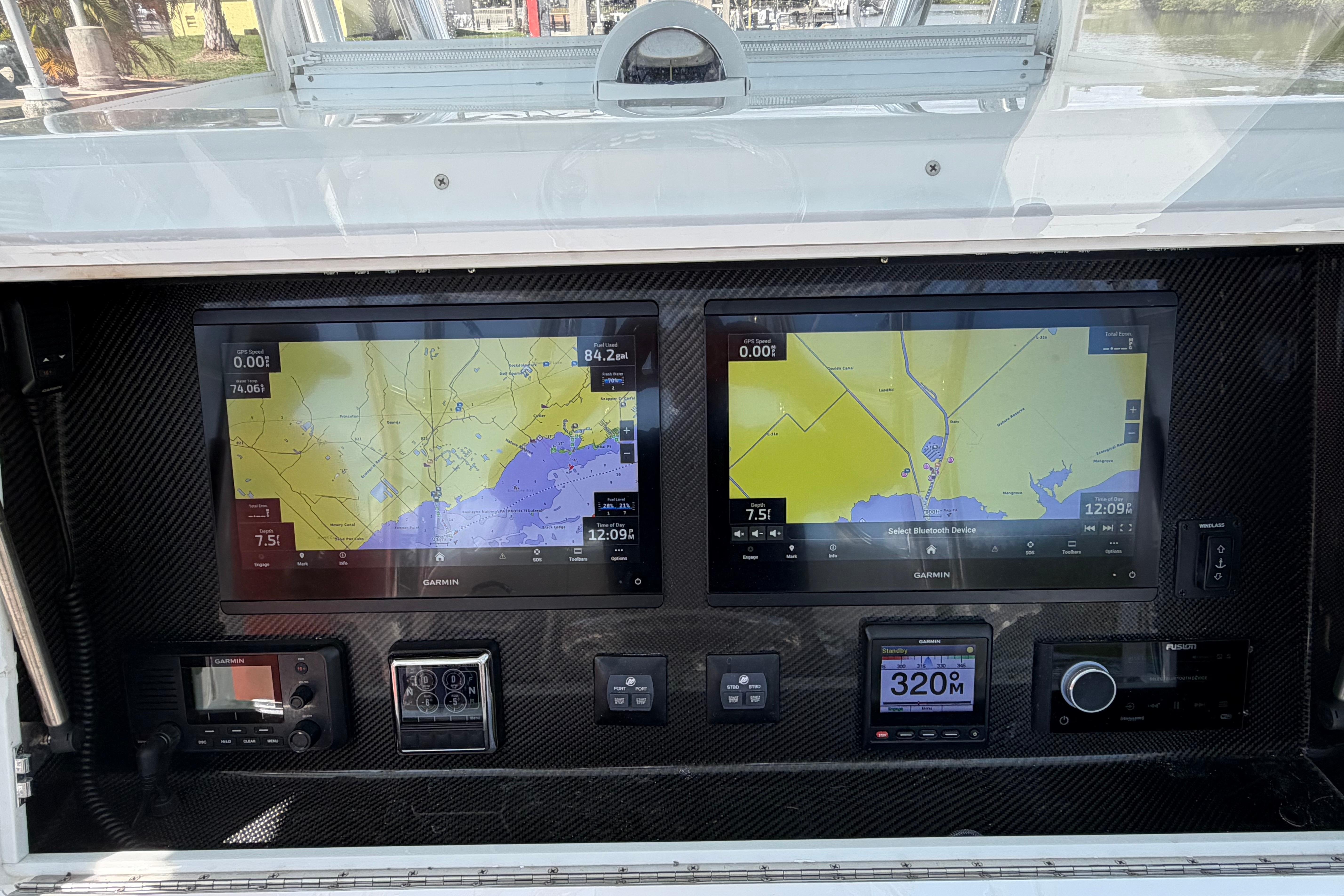2022 SeaHunter 38 CTS dashboard with dual Garmin navigation screens and controls.