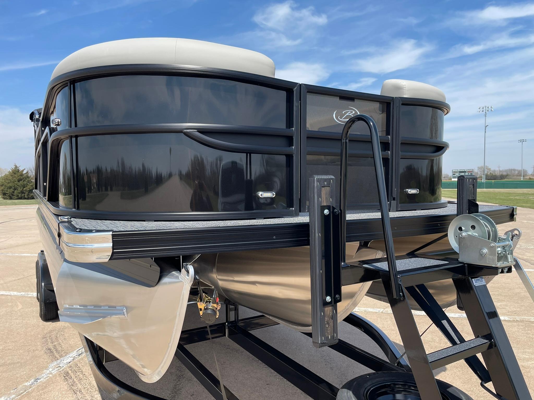 2024 Barletta Cabrio 22UC pontoon boat on trailer, front view under blue sky.
