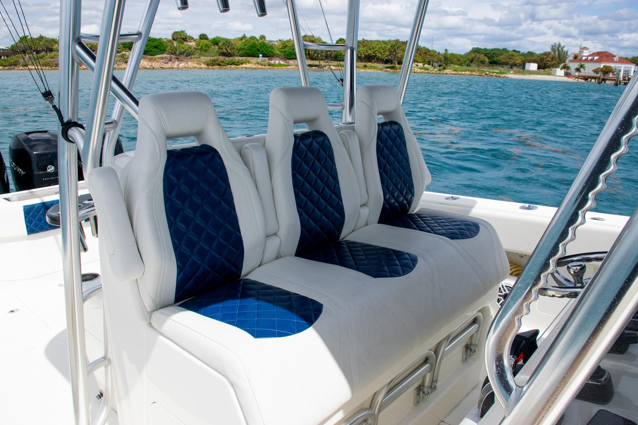 2022 SeaVee 390Z boat with luxurious blue and white seating on a sunny day.