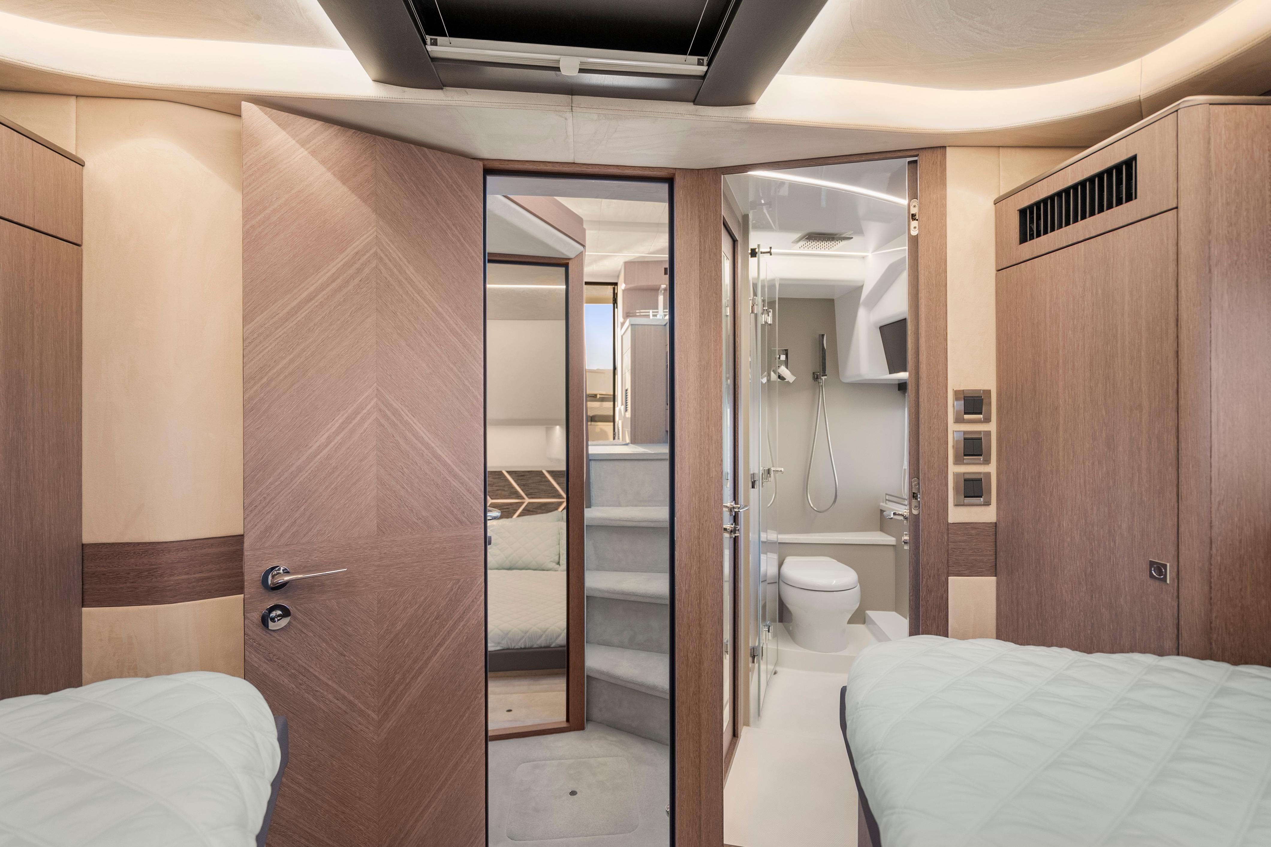 Luxurious interior of 2023 Galeon 400 Fly yacht featuring modern bathroom and cozy cabin.