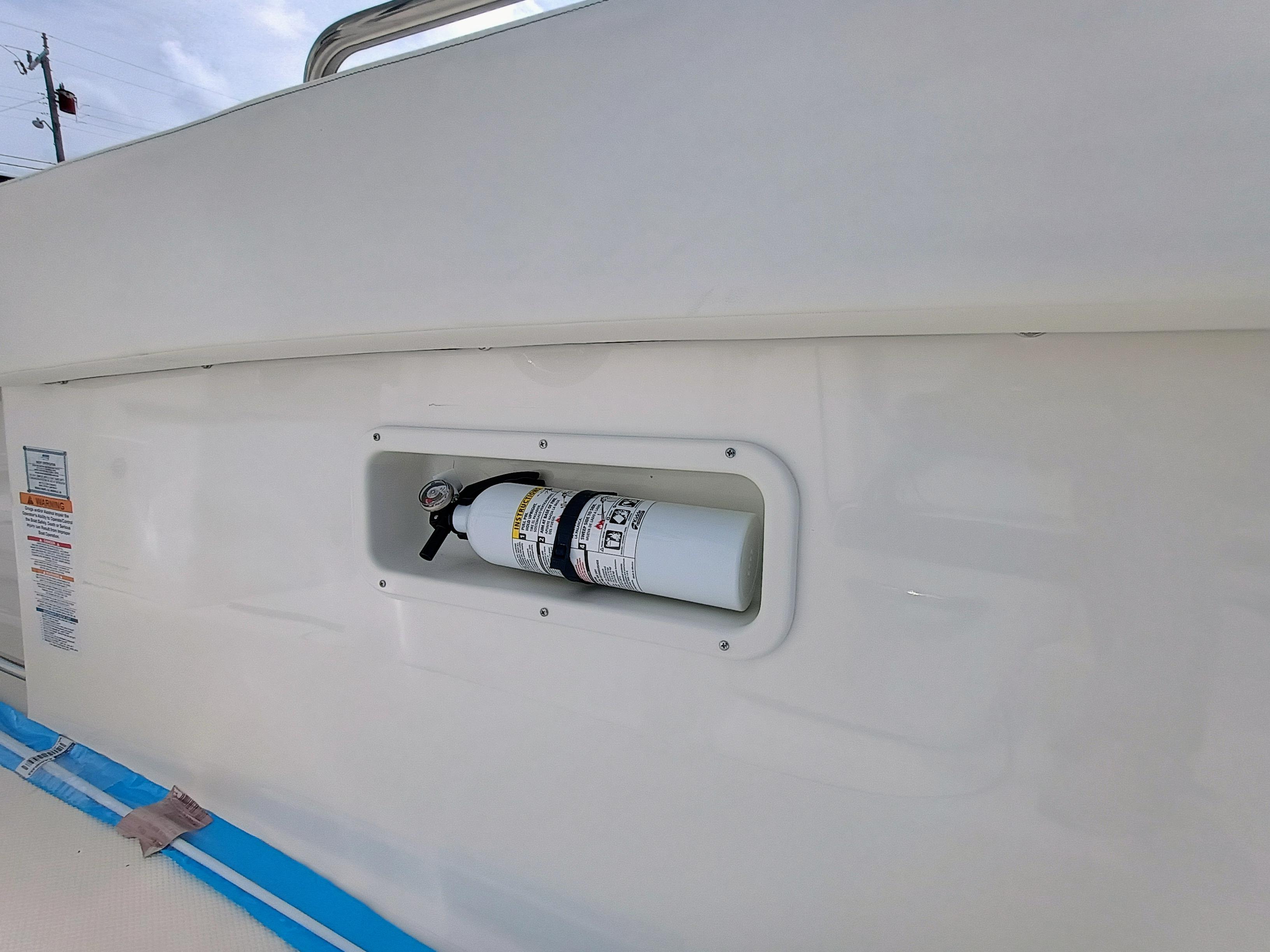 2025 Robalo R270 Center Console boat with mounted fire extinguisher.