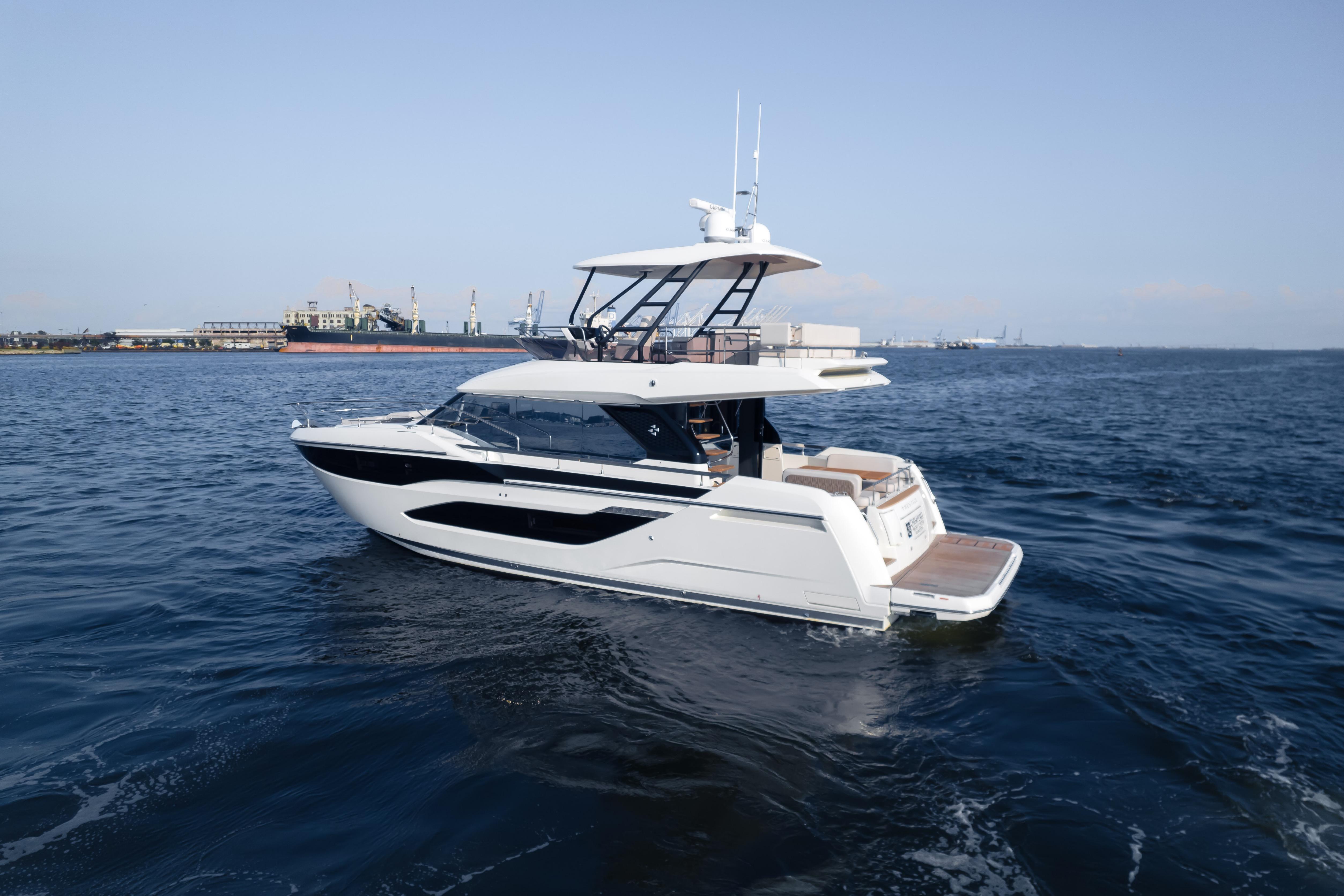 Luxury Prestige F4.9 yacht cruising on open water, 2025 model.