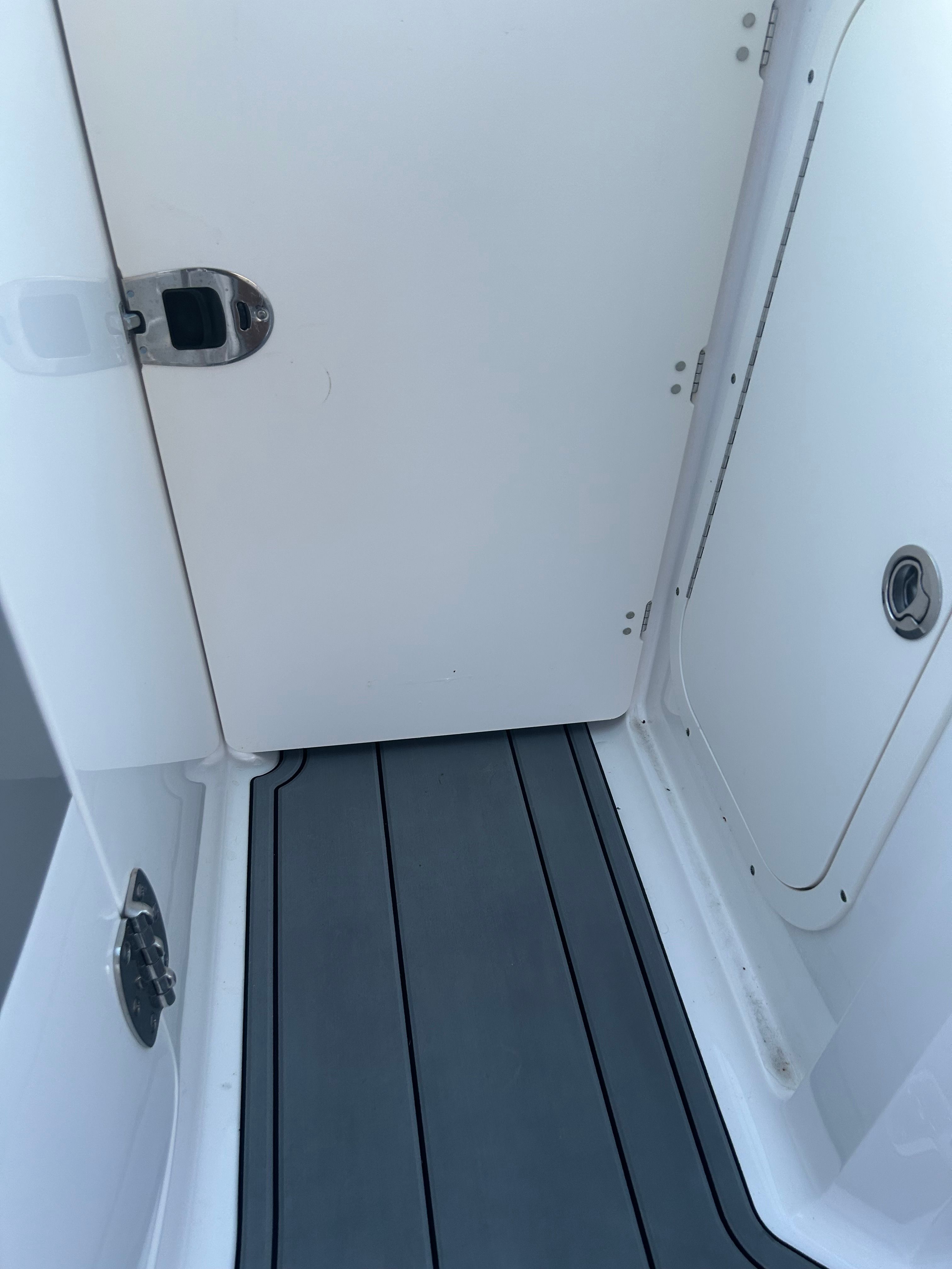 Interior of 2015 Chaparral Vortex 243 VRX with gray flooring.