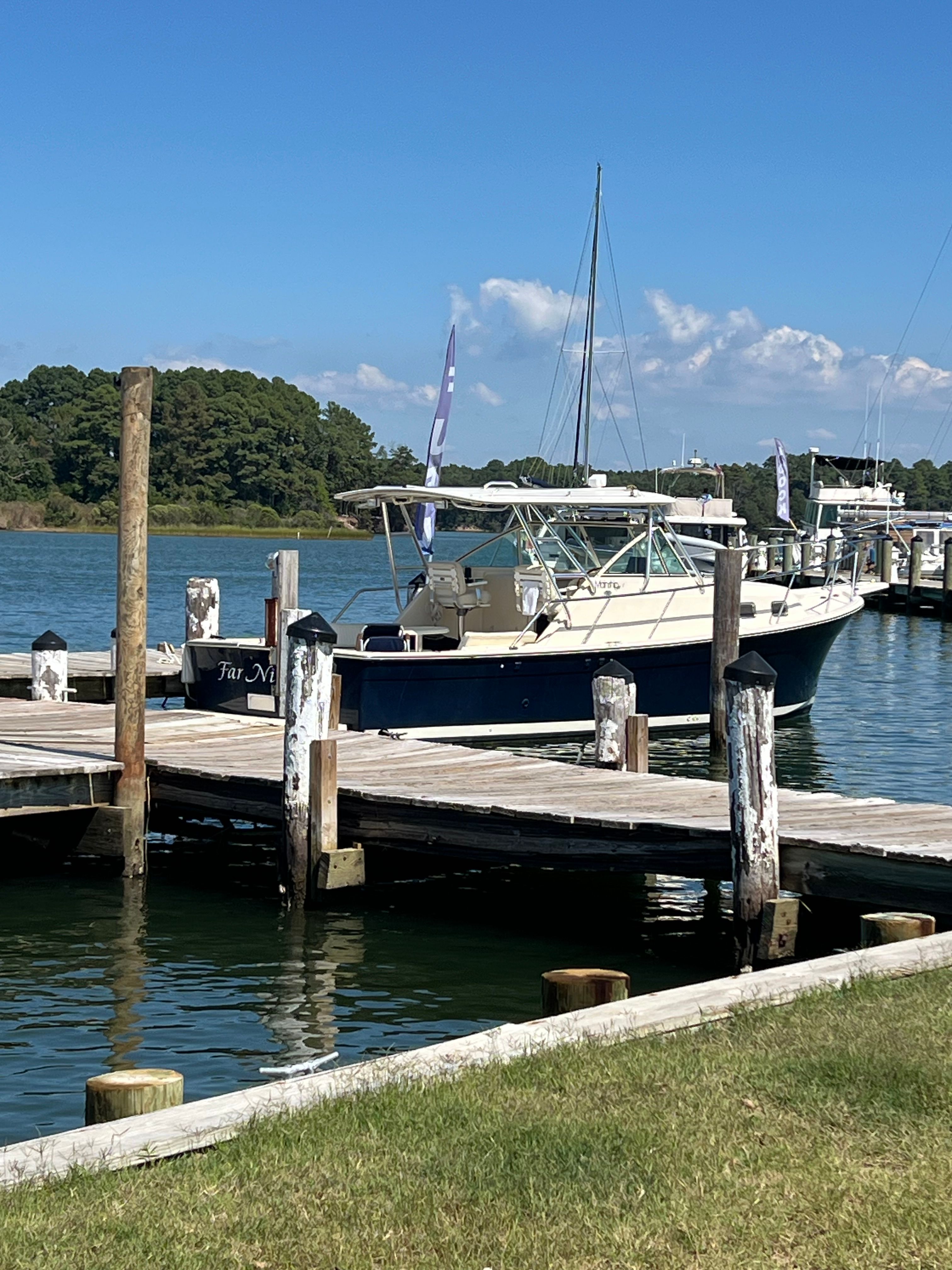 2003 Mainship Pilot 30-II docked on a sunny day.