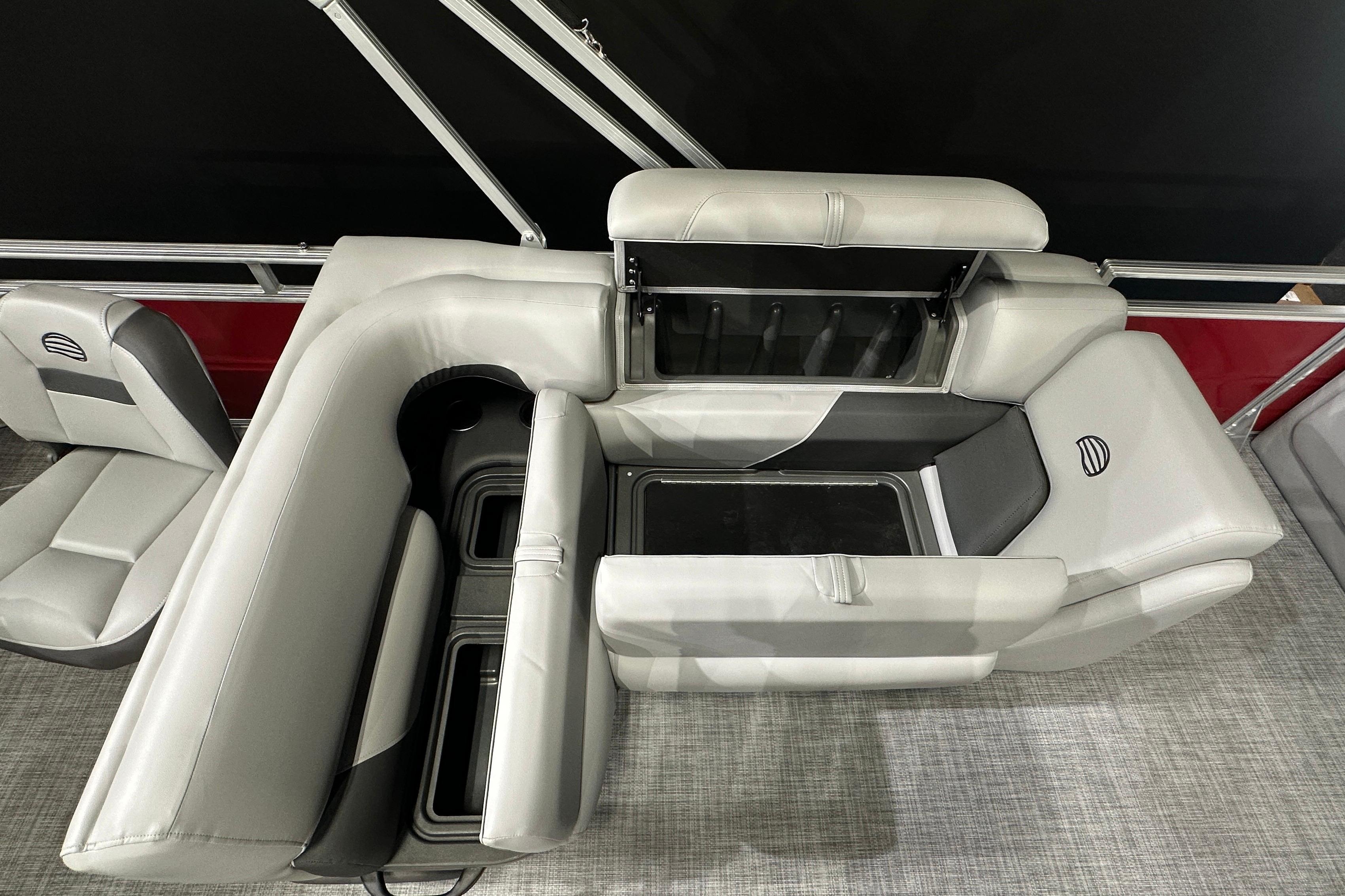 2026 Sun Tracker SportFish 22 DLX boat interior with gray seating and storage compartments.