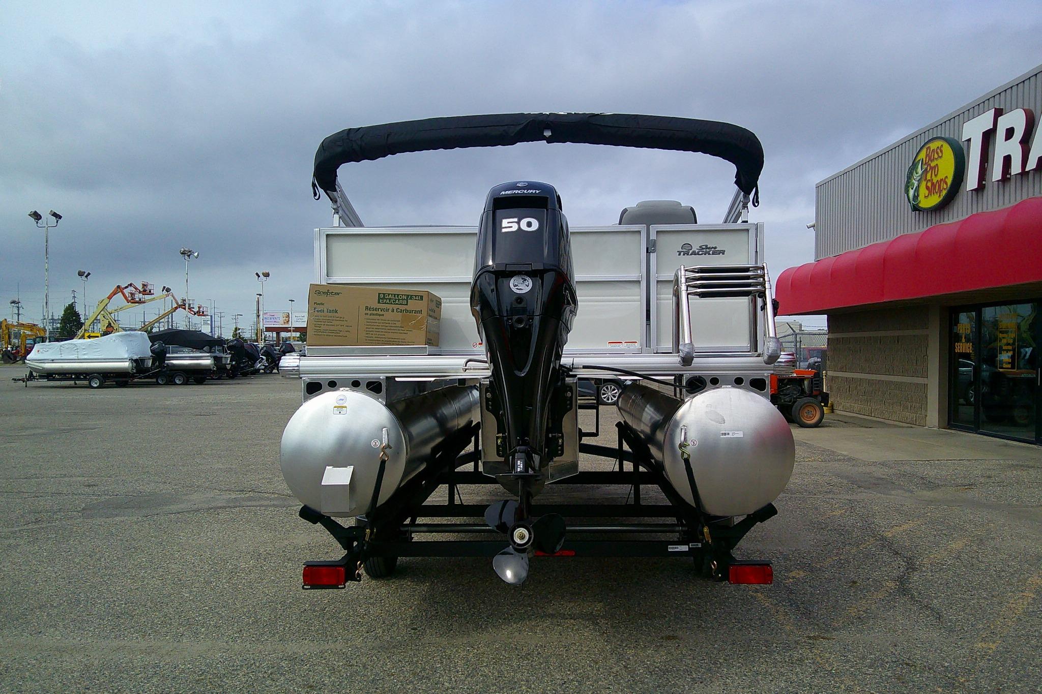2026 Sun Tracker Party Barge 16 DLX pontoon boat displayed at dealership.