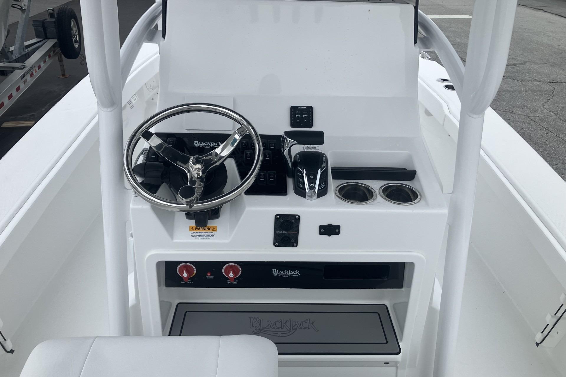 2026 BlackJack 256 Coastal boat console with steering wheel and controls.