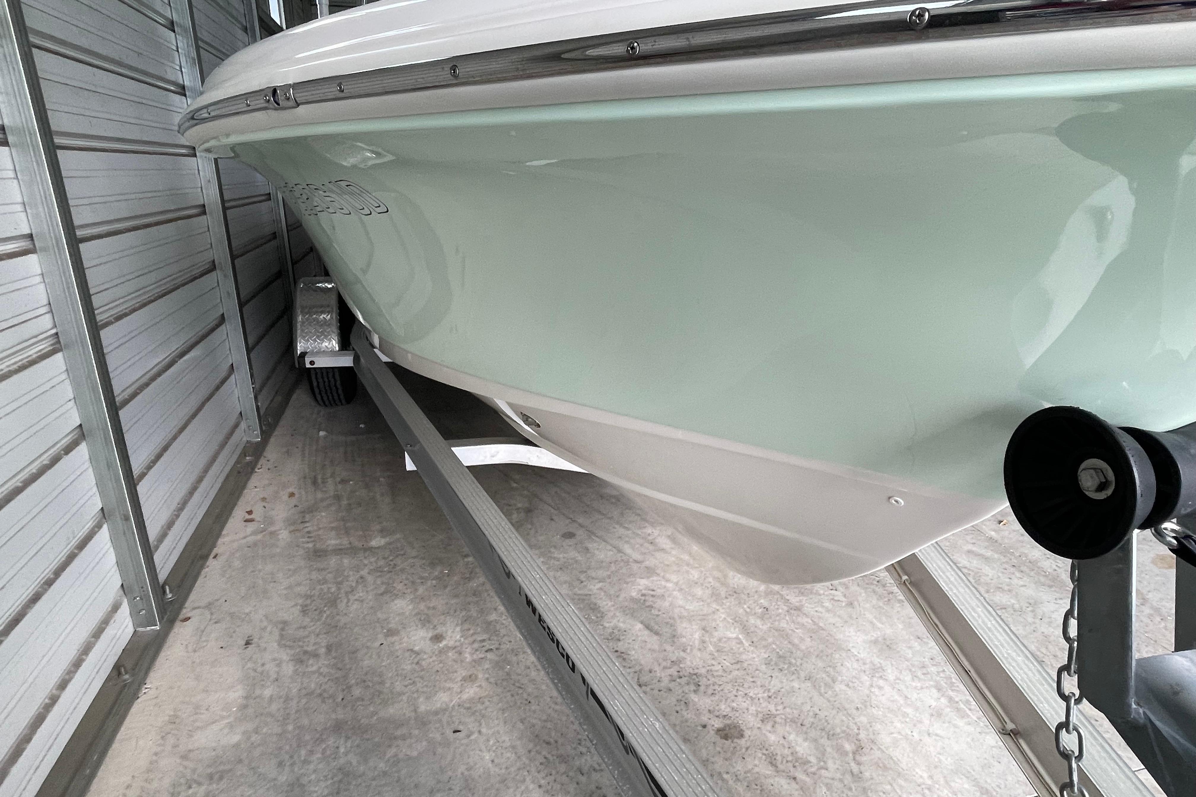 2024 Pioneer 180 Islander boat on trailer in storage facility.