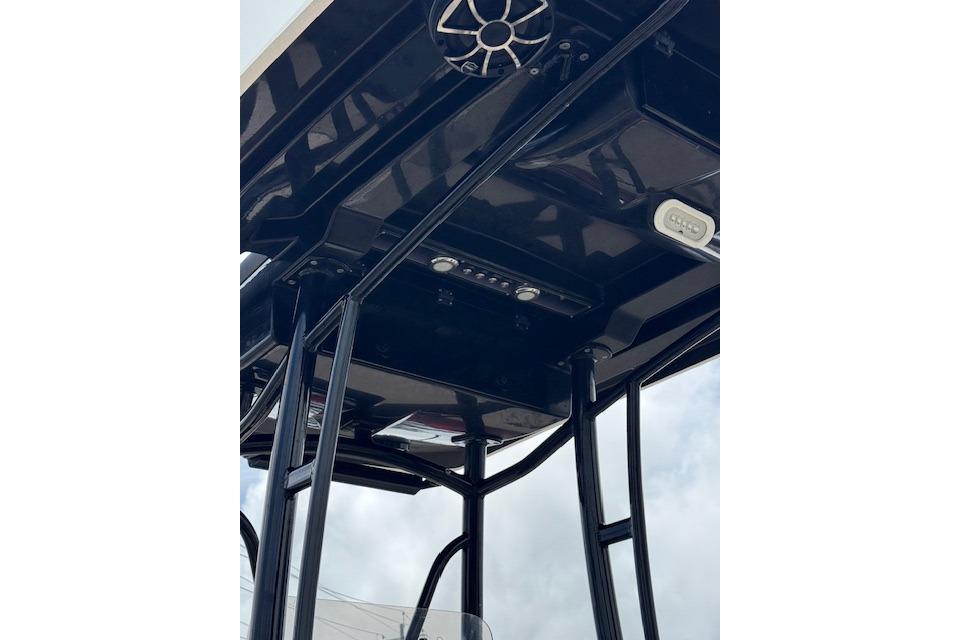 2019 Blue Wave 2400 PureBay boat T-top with speakers and lights, viewed from below.