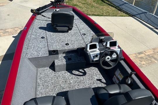 2026 Tracker Pro Team 175 boat interior with steering wheel and seating.