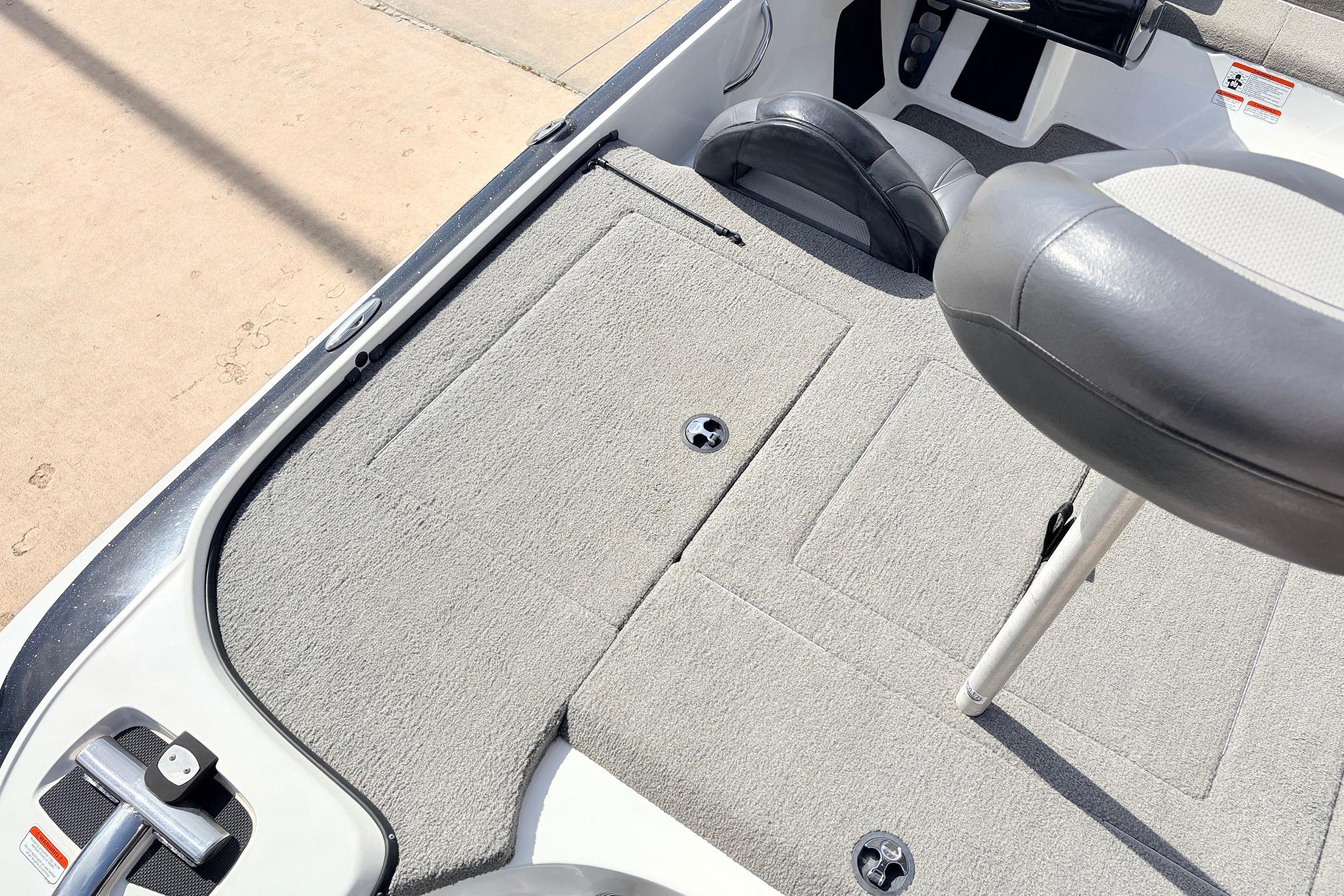 Interior of a 2011 Nitro Z-7 boat featuring gray carpet and seating.