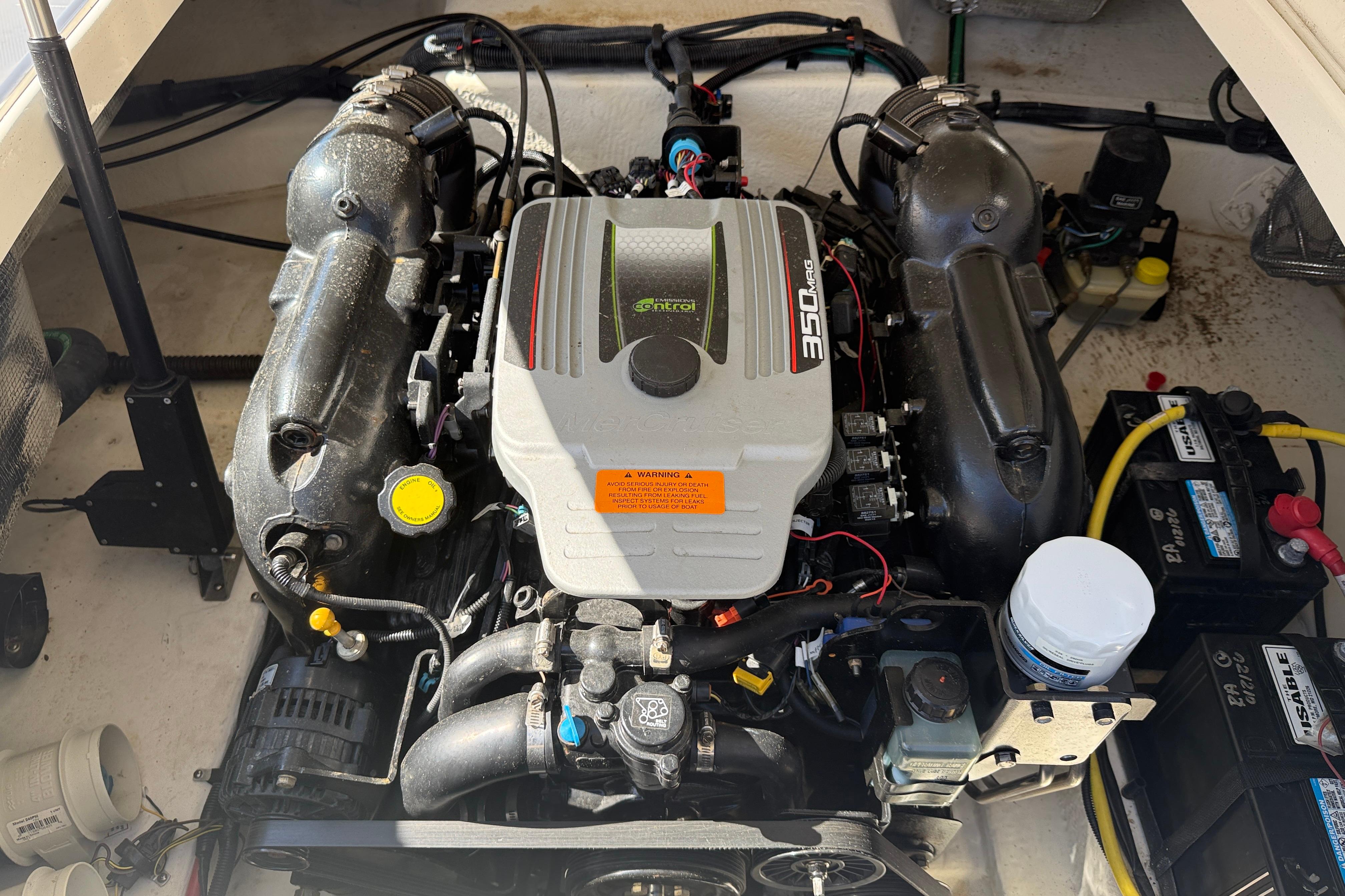Engine compartment of a 2014 Chaparral 264 Sunesta boat, featuring a 350 MAG engine.