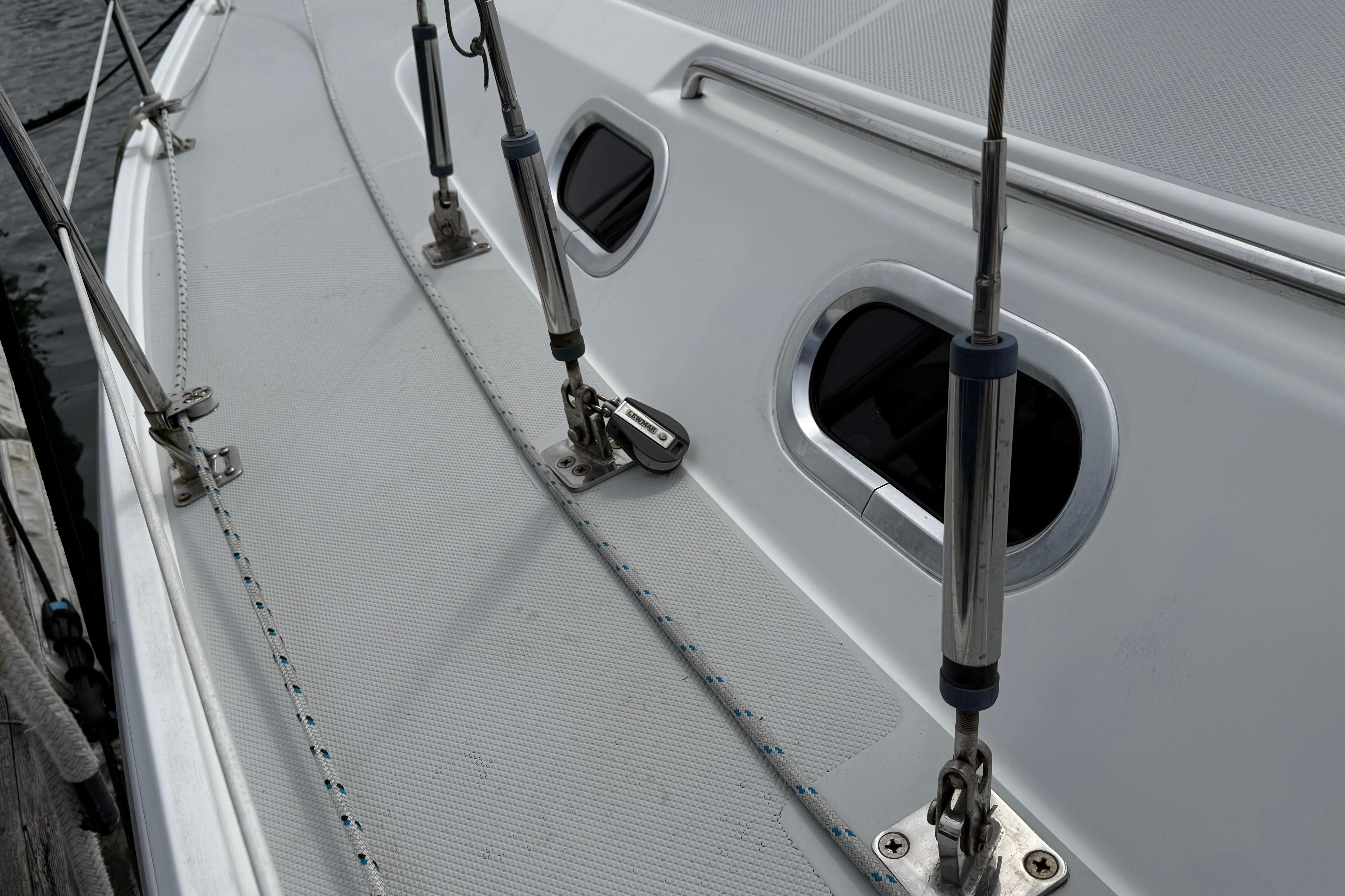 Close-up of 2005 Catalina 36 MkII sailboat deck with rigging and windows.