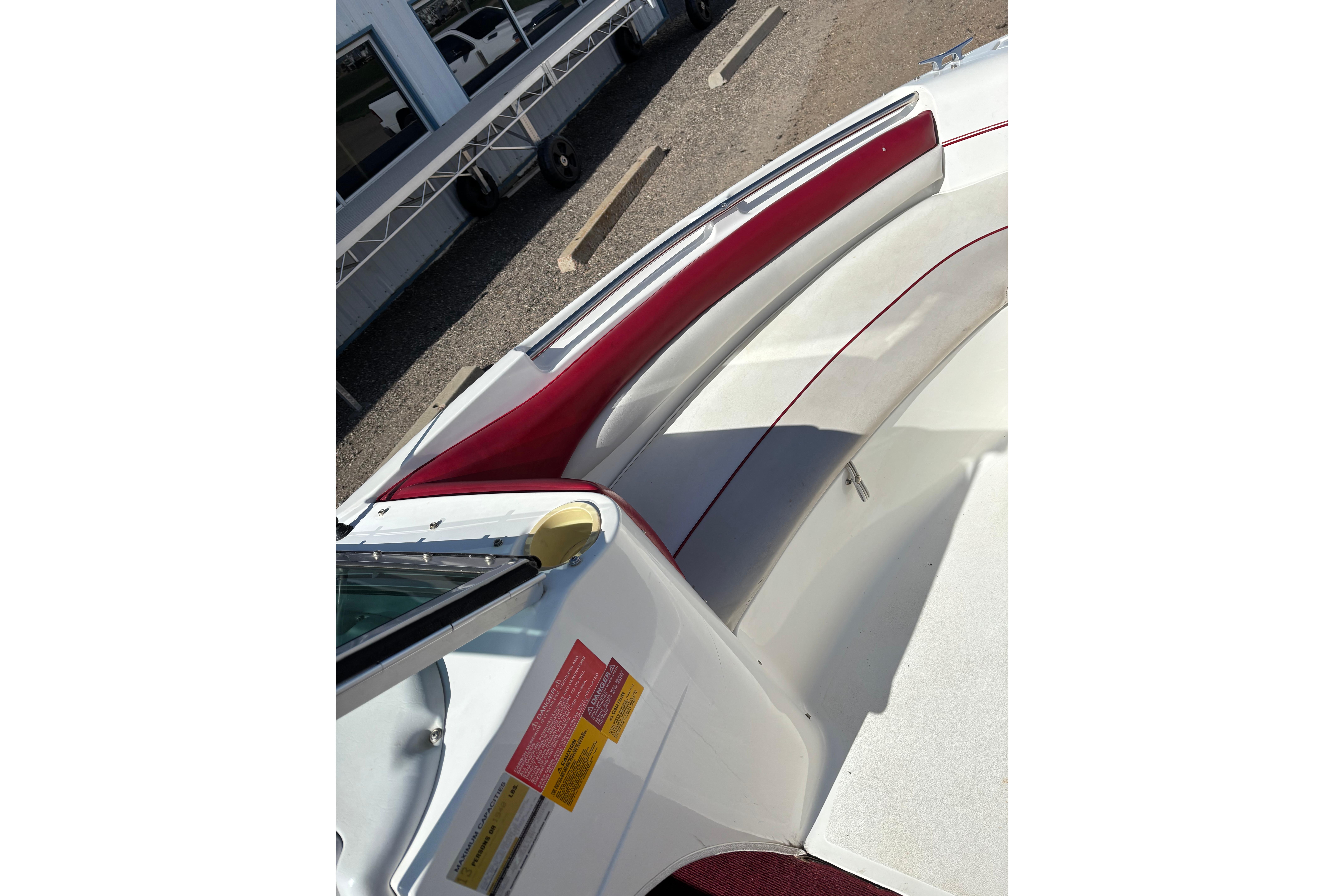1993 Larson SEi 200 Cuddy I/O boat interior with red and white seating.