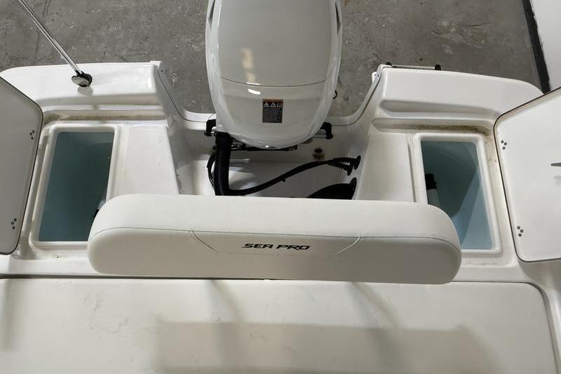 2026 Sea Pro 172 Bay boat interior with motor and storage compartments.