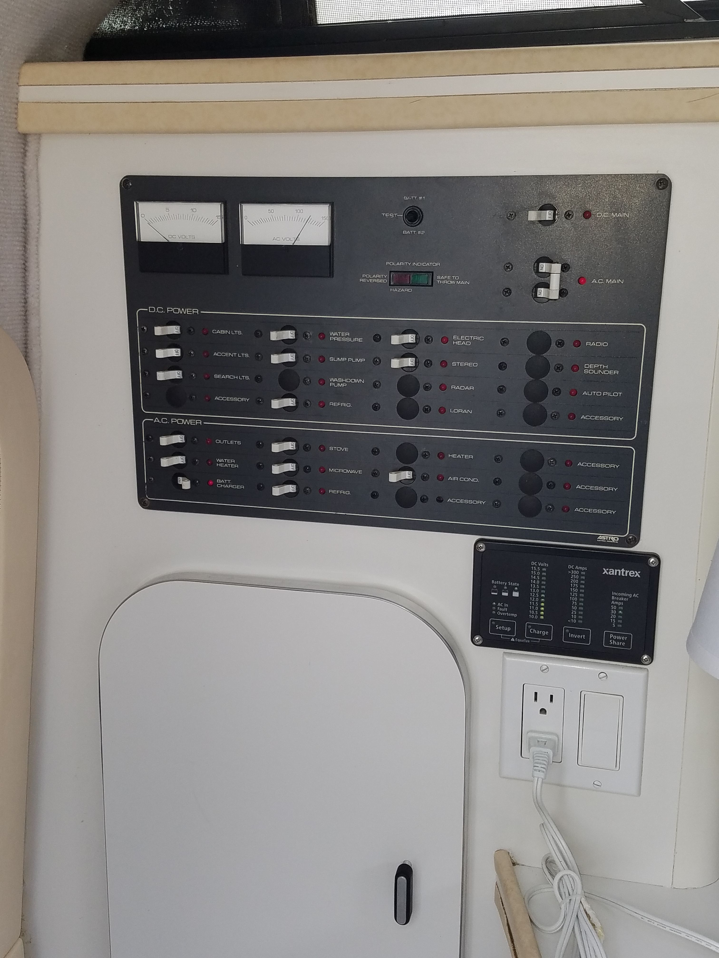Electrical panel setup in a 1989 Tiara Yachts Slickcraft.