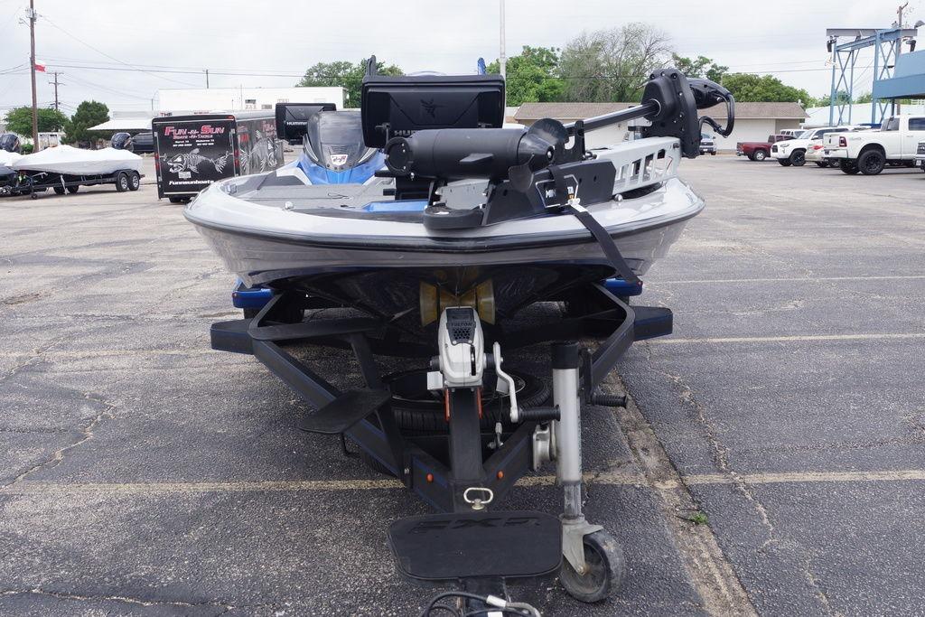 2020 Skeeter FXR21 Limited boat on trailer in parking lot.