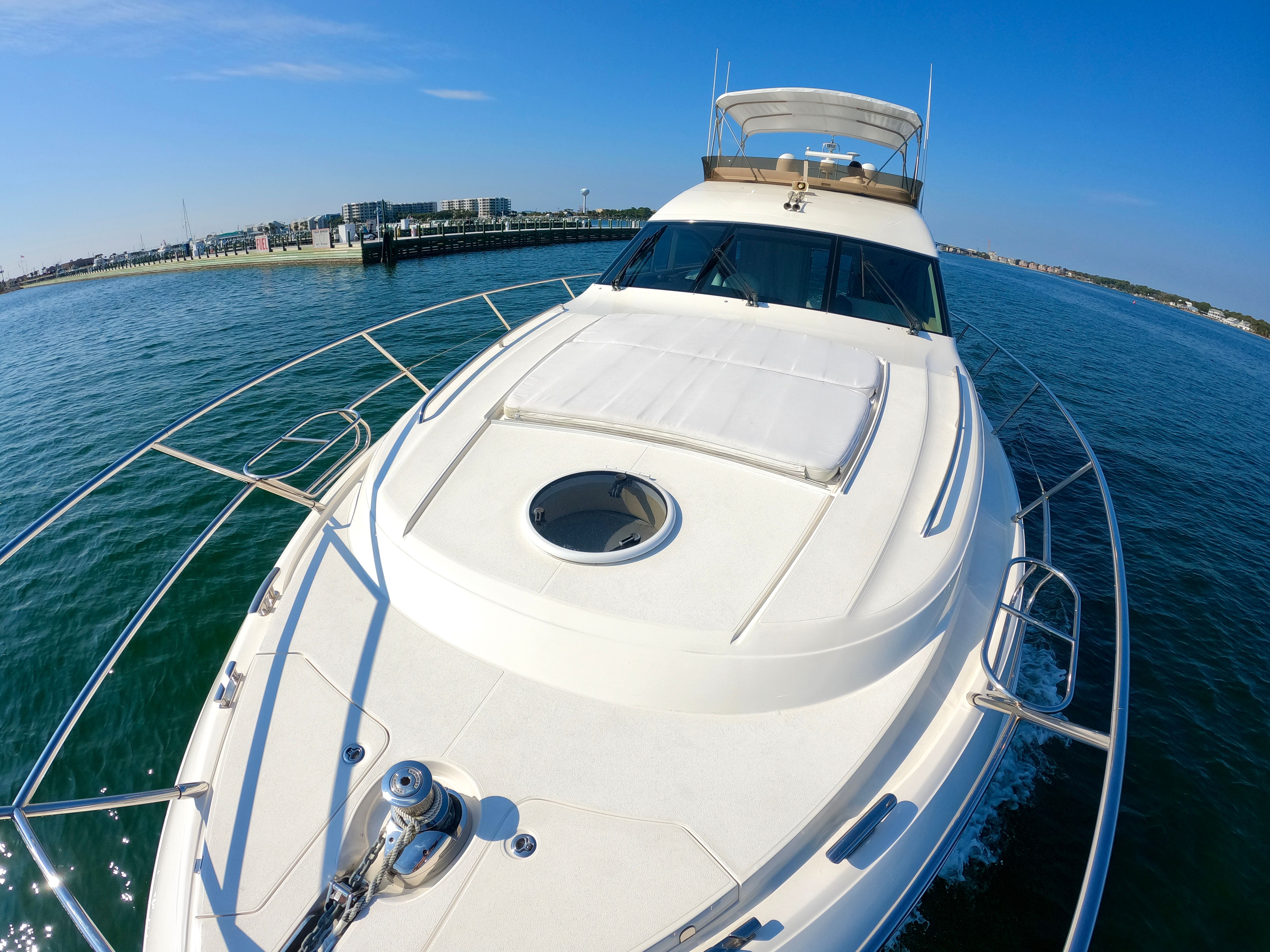 2009 Viking Princess F54 Flybridge yacht cruising on open water.