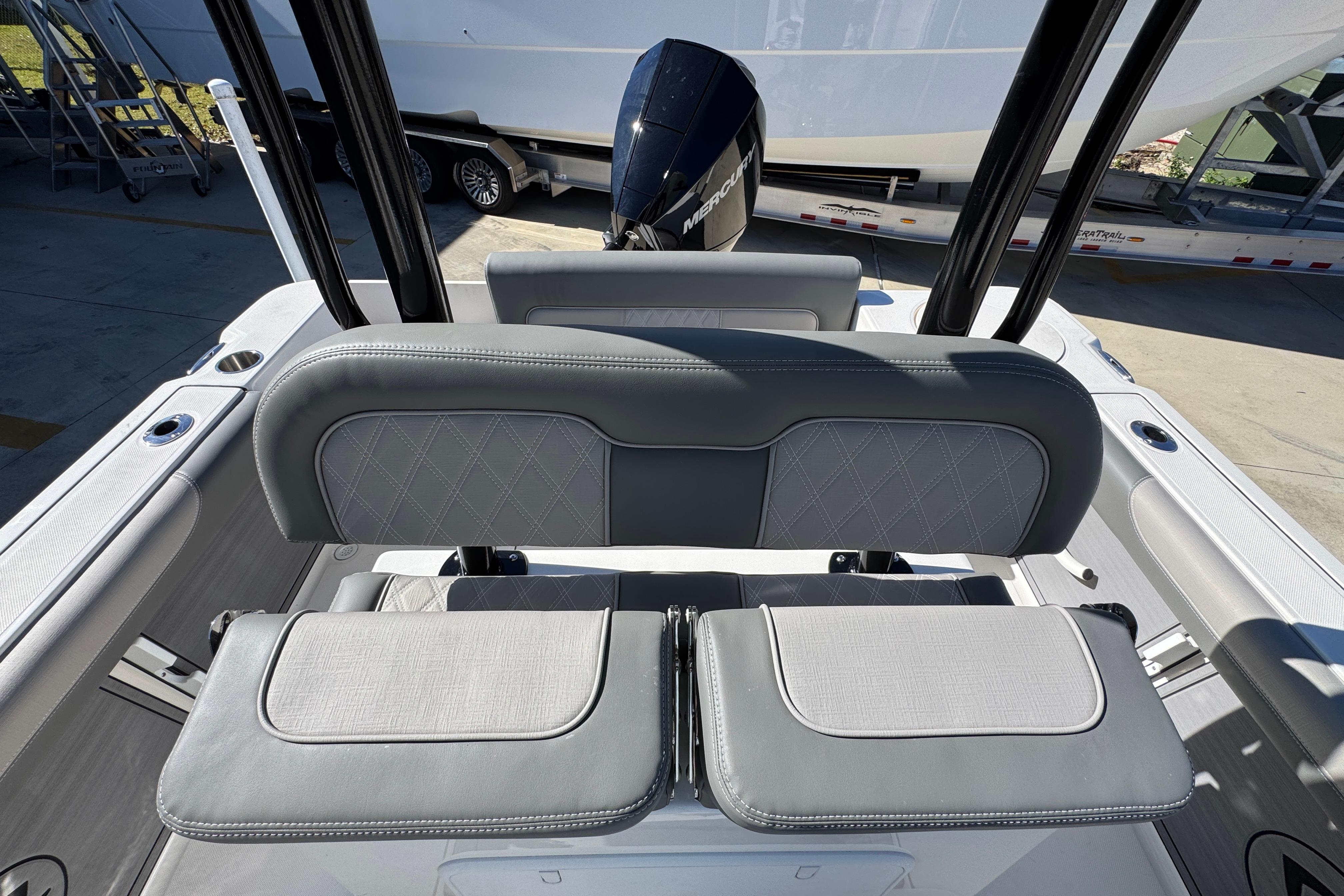 2026 Sea Born LX22 Center Console boat interior with cushioned seating and outboard motor.