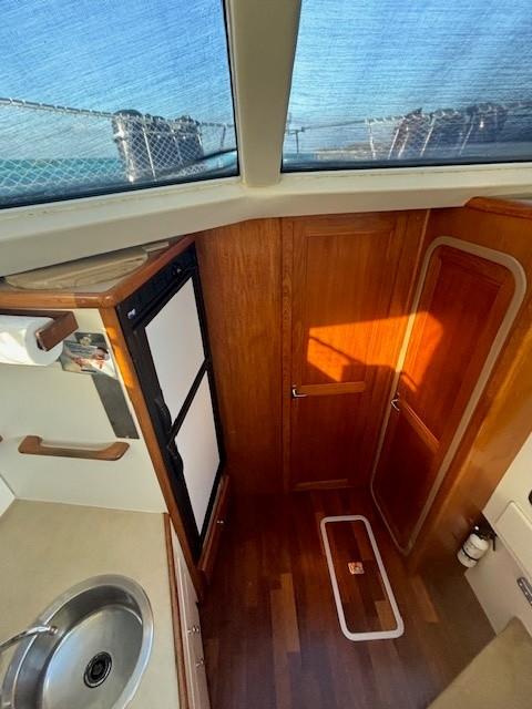 Interior view of 1998 Carver 400 AFT Cockpit yacht with wood finish and skylight.