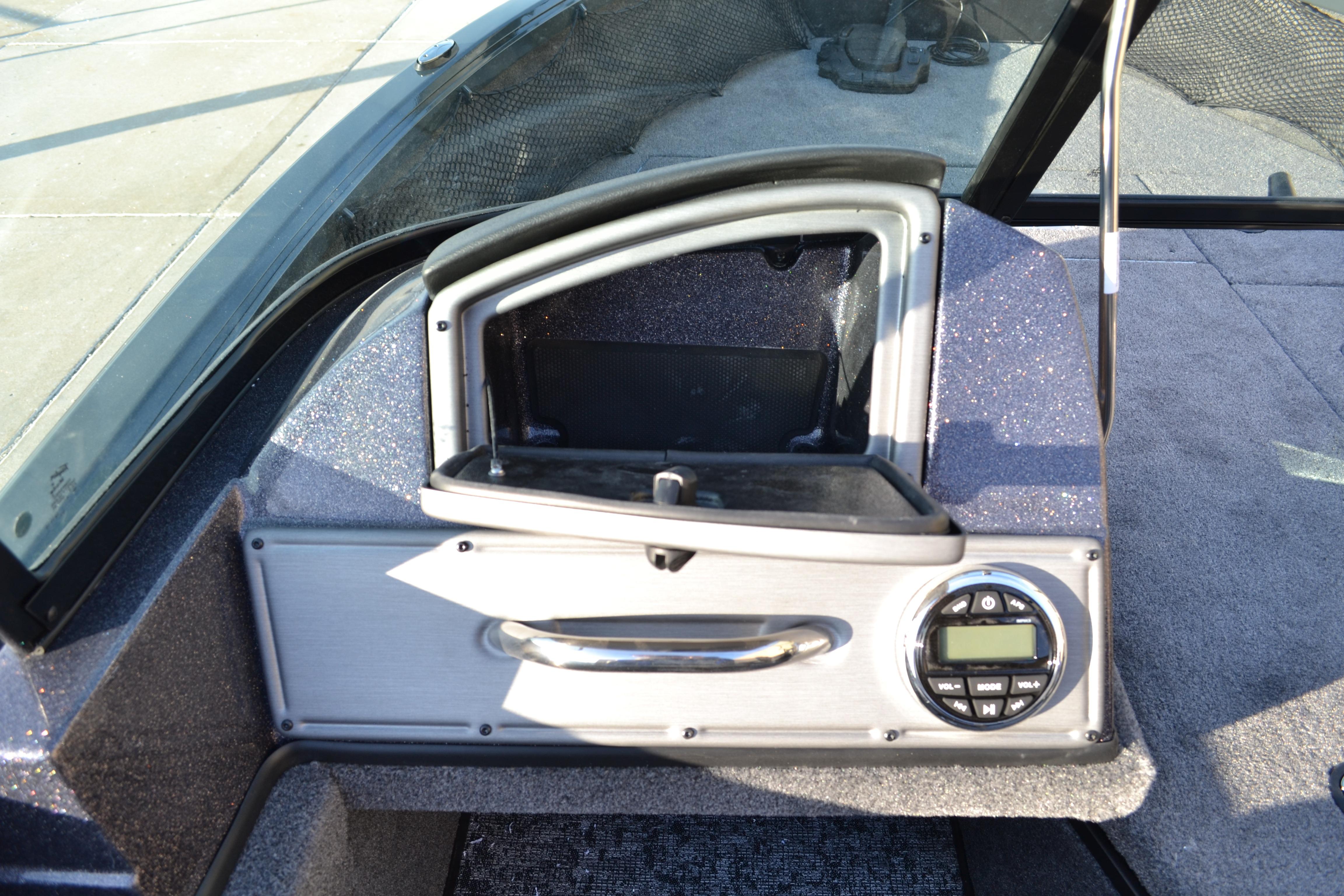 2026 Ranger VS1882SC Reata boat dashboard with storage compartment and audio controls.