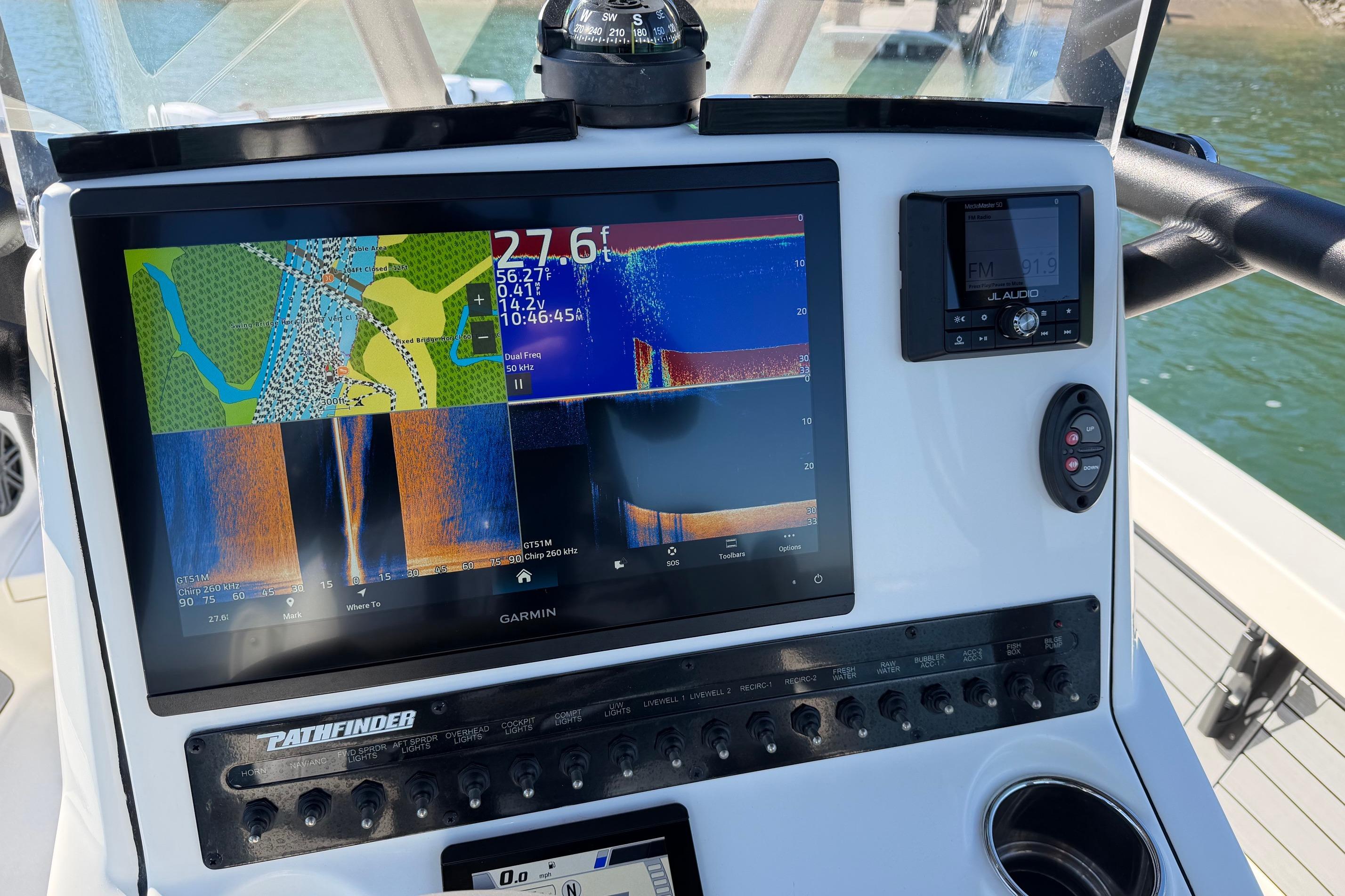 2024 Pathfinder 2500 Hybrid boat dashboard with Garmin navigation display.