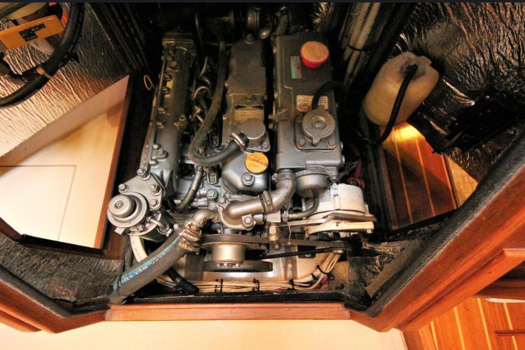 Engine compartment of a 2000 Island Packet 420 sailboat, showcasing detailed mechanical components.