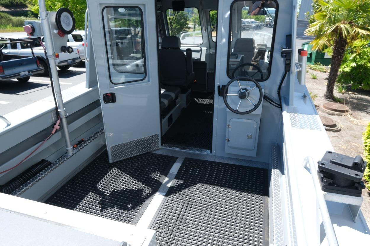2018 Hewescraft 220 Ocean Pro ET Hardtop boat interior with open cabin door.