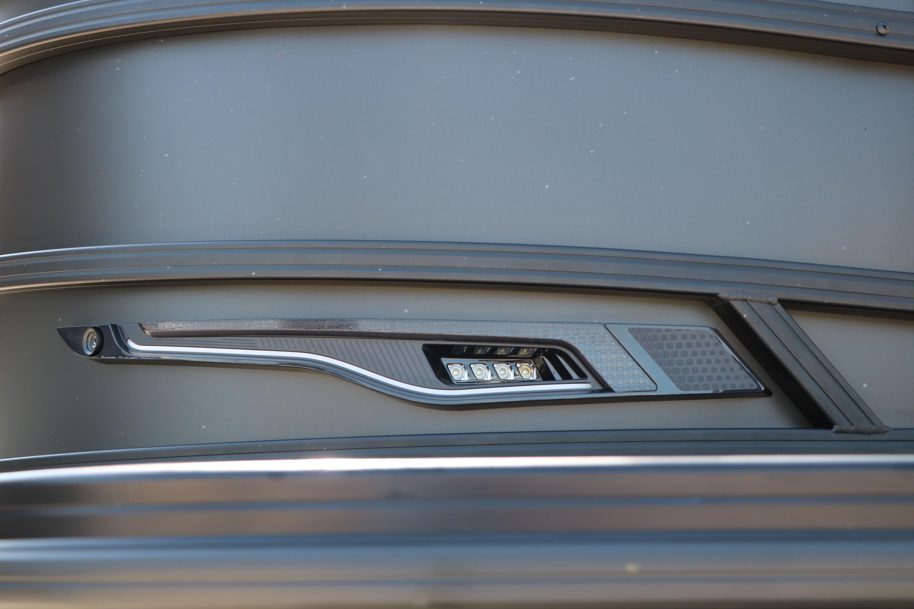Close-up of 2026 Evotti 725 CS Tri-Toon boat's sleek exterior design detail.