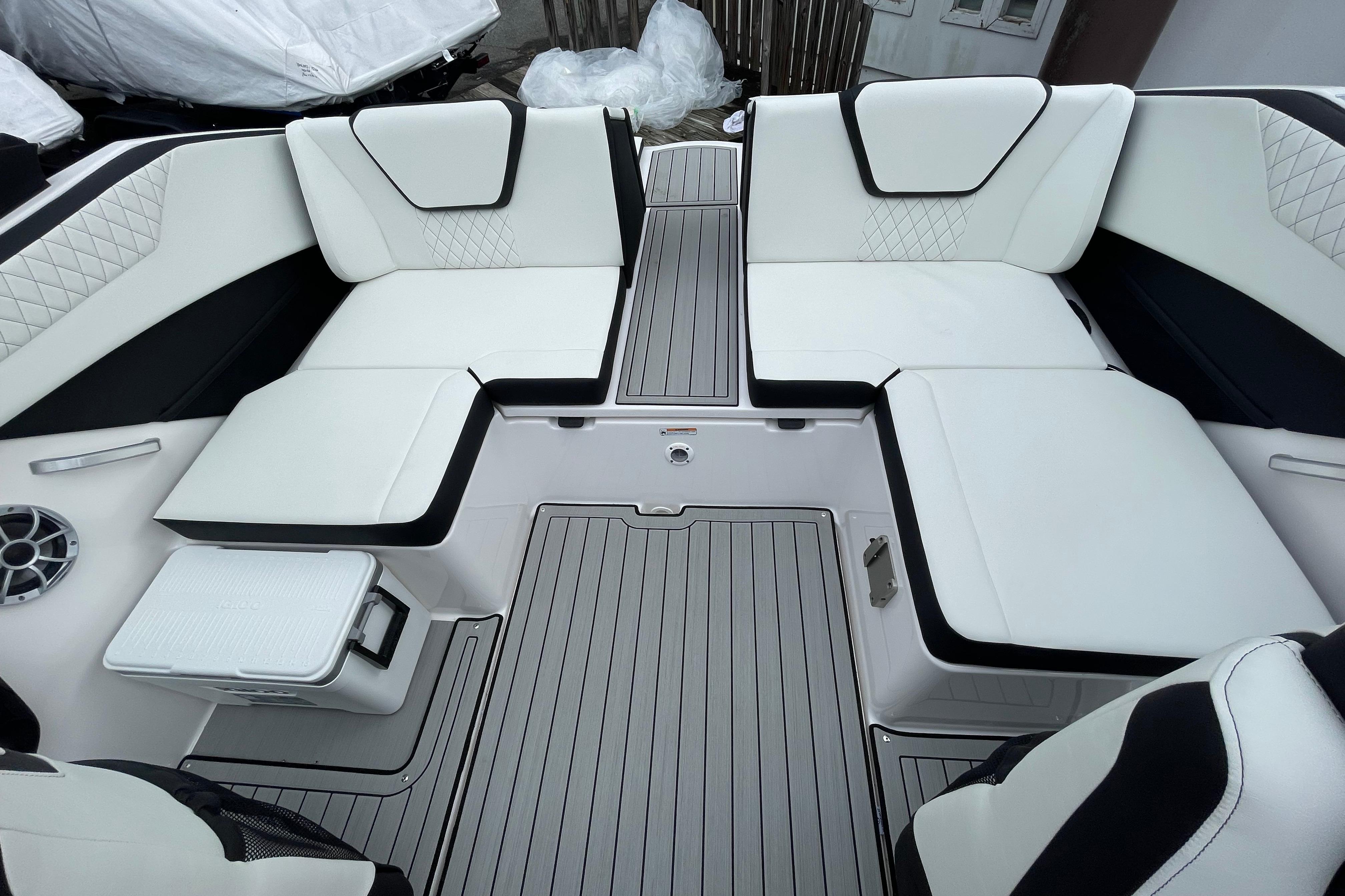 2026 Yamaha Boats 222S interior with white cushioned seating and sleek flooring.