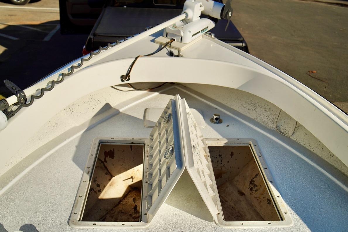 1970 Aquasport 222 Flatback boat deck with open storage compartments.