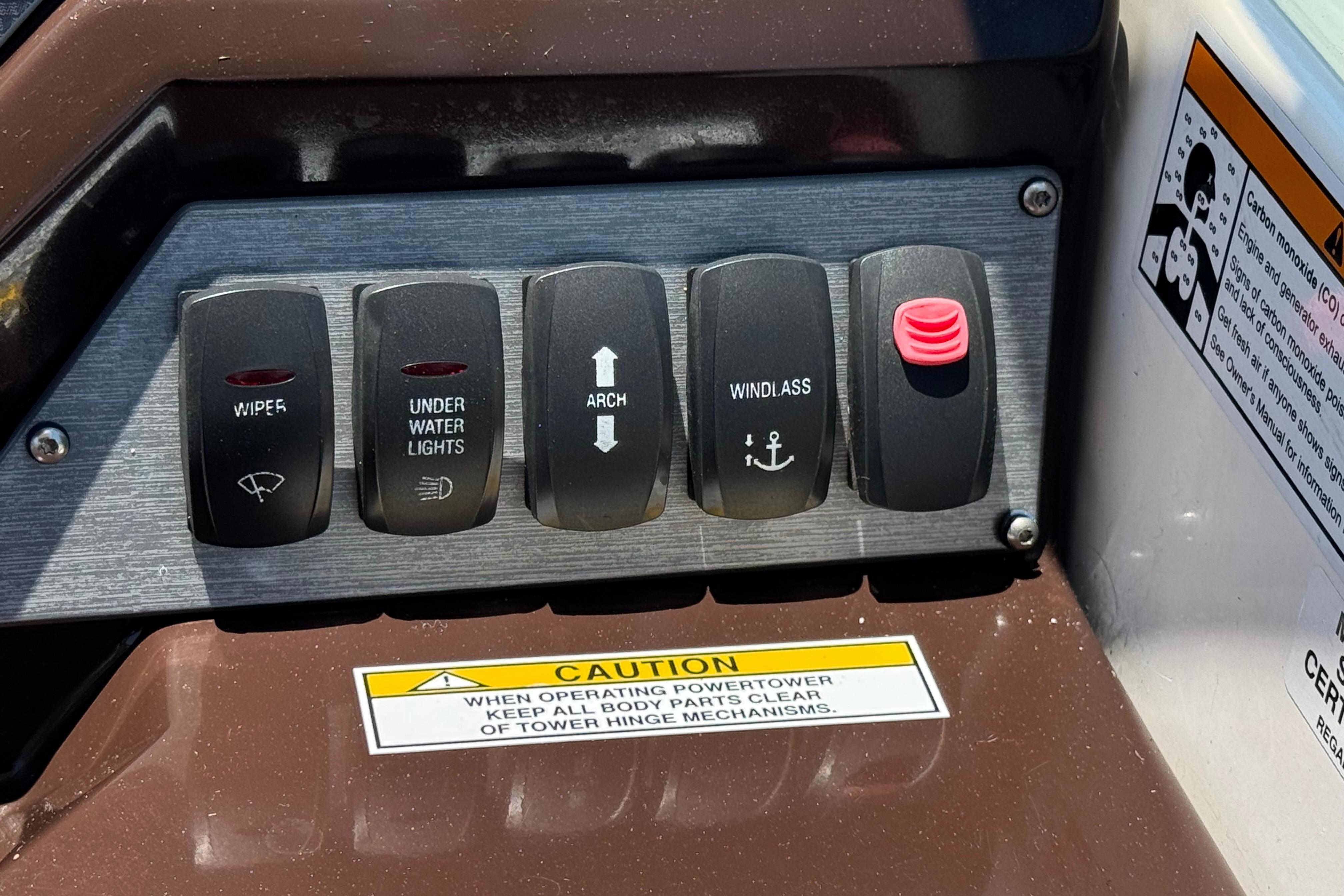 Control panel of a 2013 Regal 28 Express boat with labeled switches.