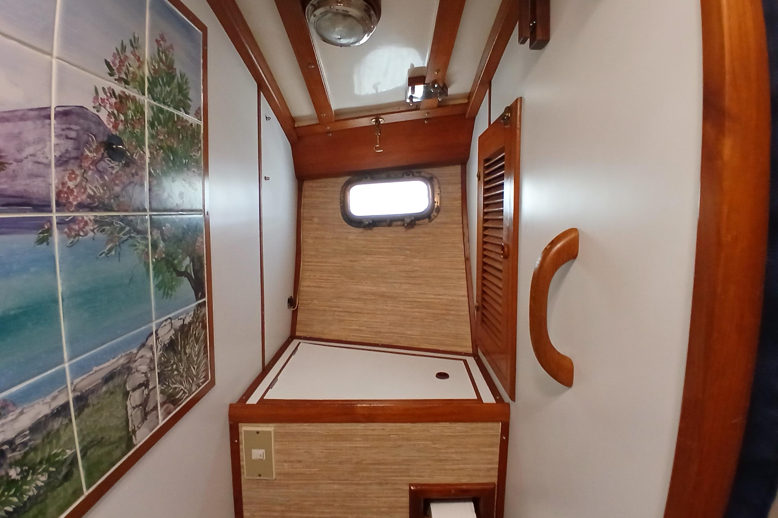 Interior of 1985 Kadey-Krogen 38 with nautical decor and wooden accents.