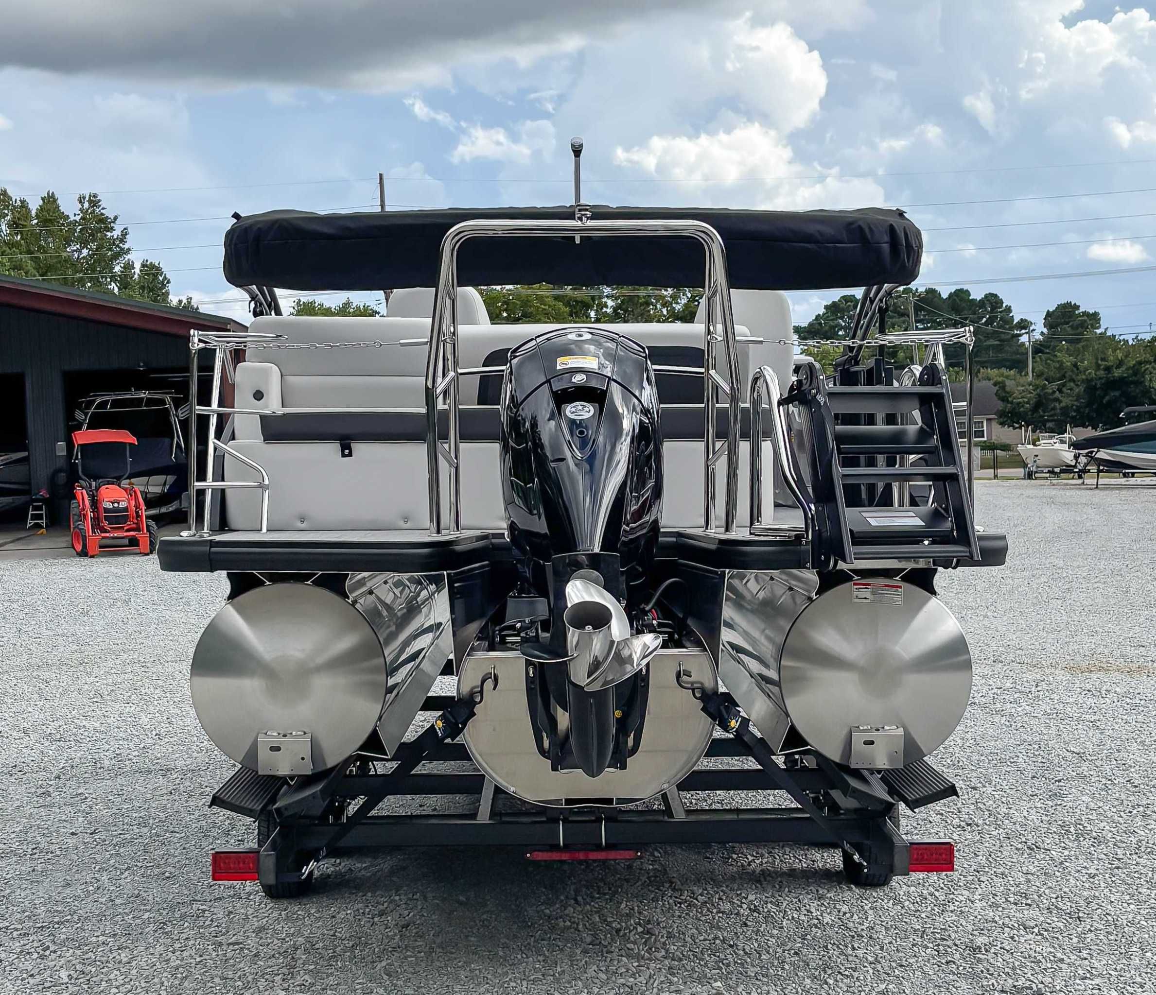 2026 Harris Cruiser 230 SLDH, rear view, on trailer, outboard motor.