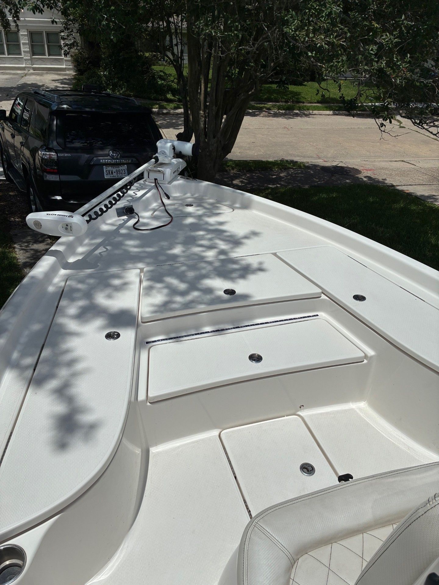 The image shows the deck of a 2018 Custom 2200 Pure Bay boat.
