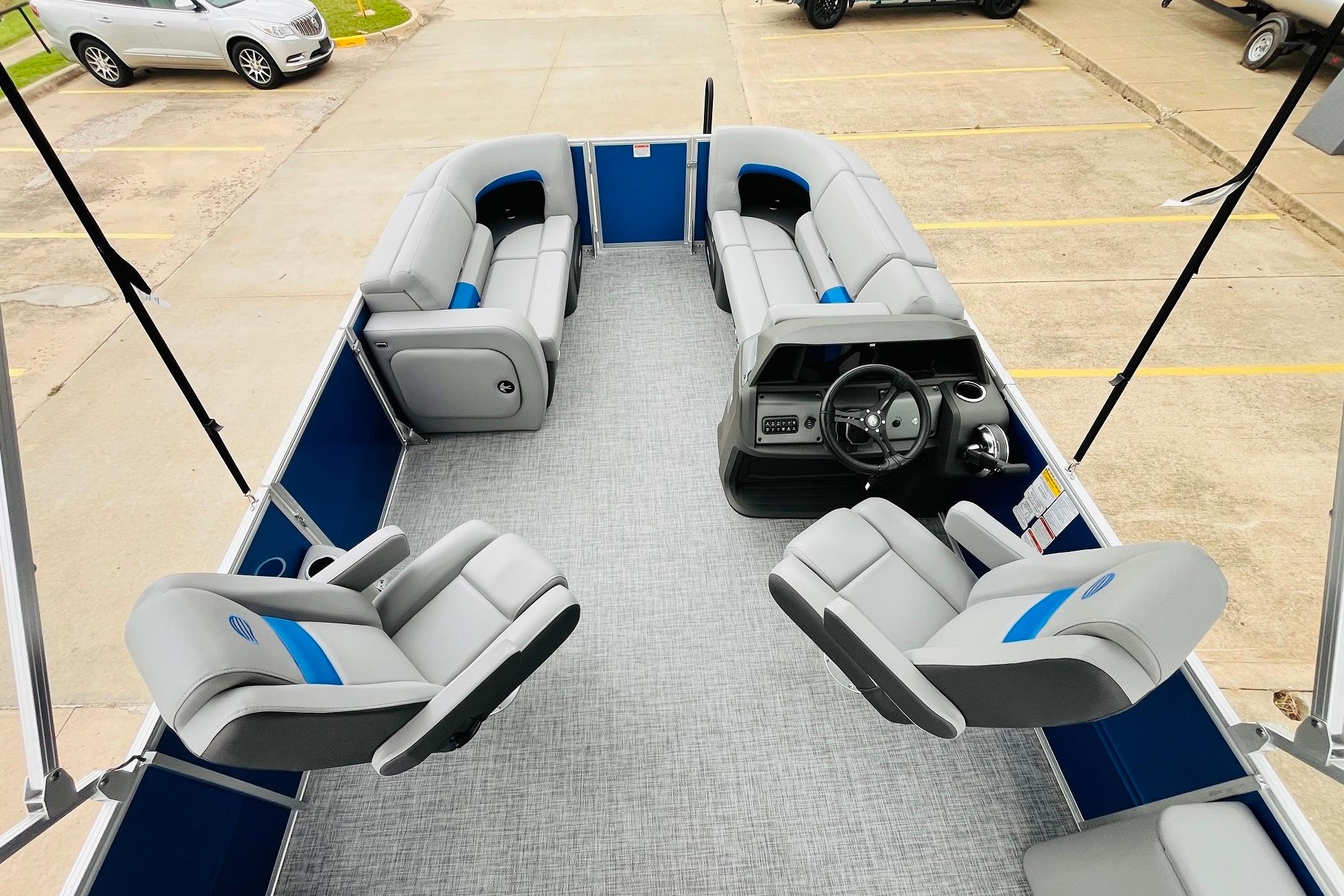 2026 Sun Tracker Party Barge 22 RF DLX interior with spacious seating and modern helm.