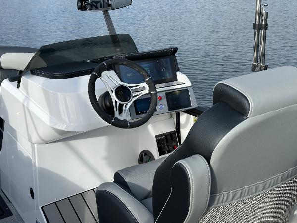 2025 Montara Surf Boss 2.0 25 boat interior with modern steering and dashboard controls.