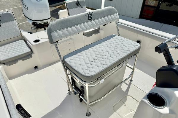 2025 Carolina Skiff 21 LS boat interior with cushioned seating and storage.