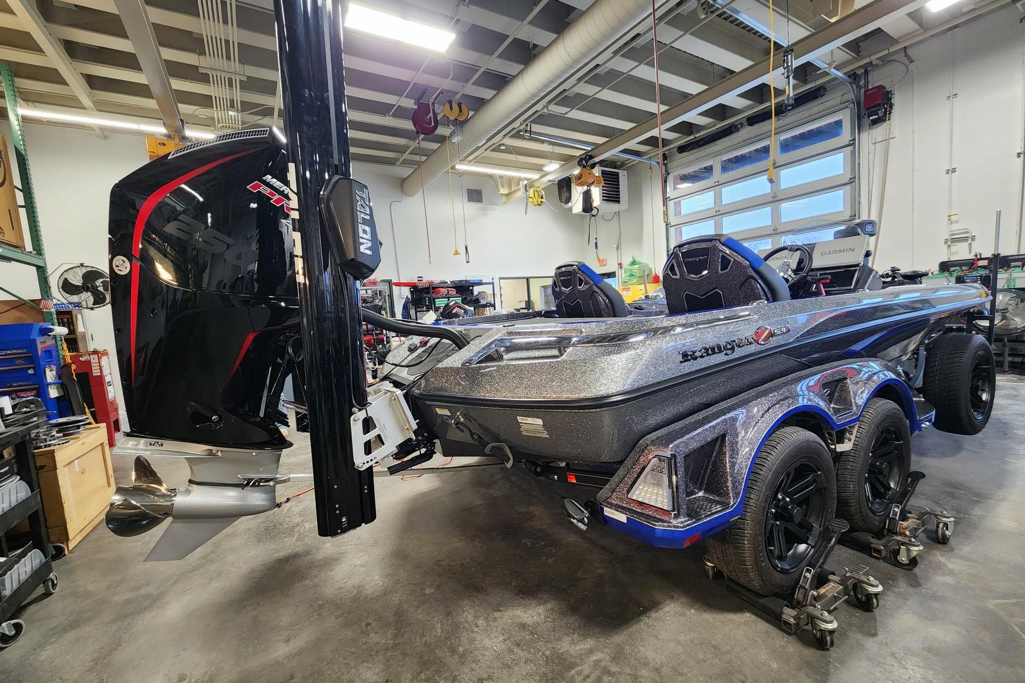 2025 Ranger Z521R boat in a workshop, featuring a powerful outboard motor.