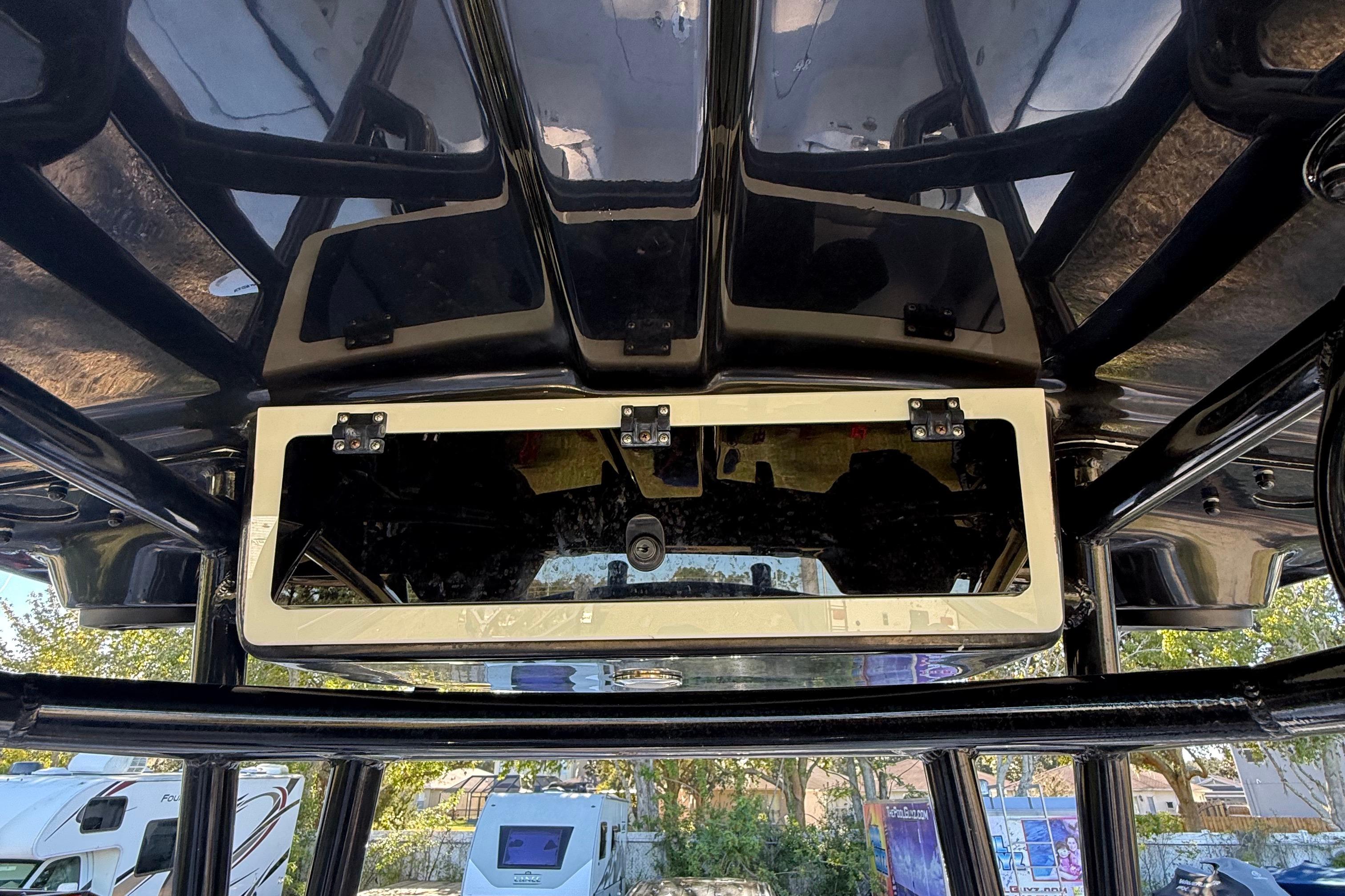 2021 Carolina Skiff 26 Ultra Elite boat console with storage compartment and sleek design.