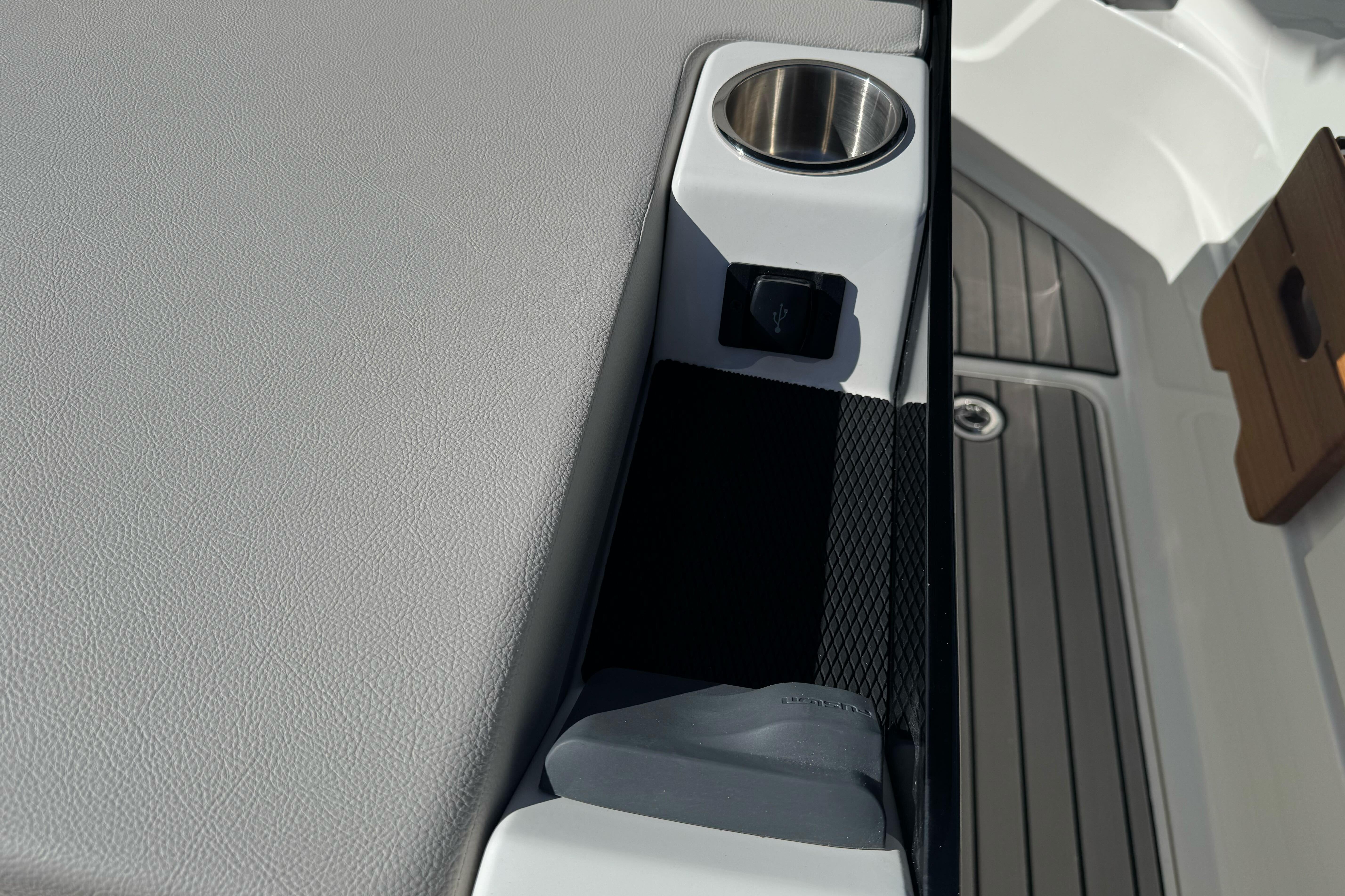 2026 Sea Ray SLX 260 boat interior with cup holder and USB port.