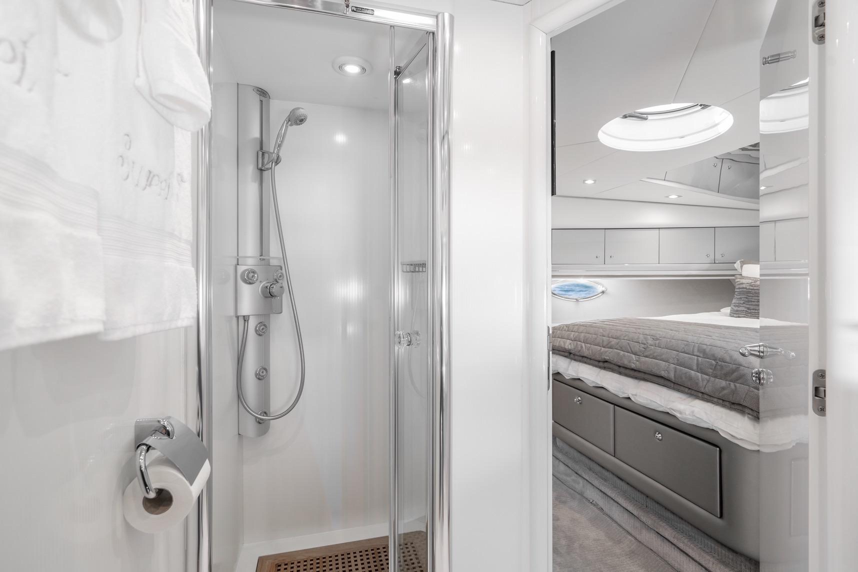 Luxurious bathroom and bedroom interior of 2021 Sunseeker Predator 68 yacht.