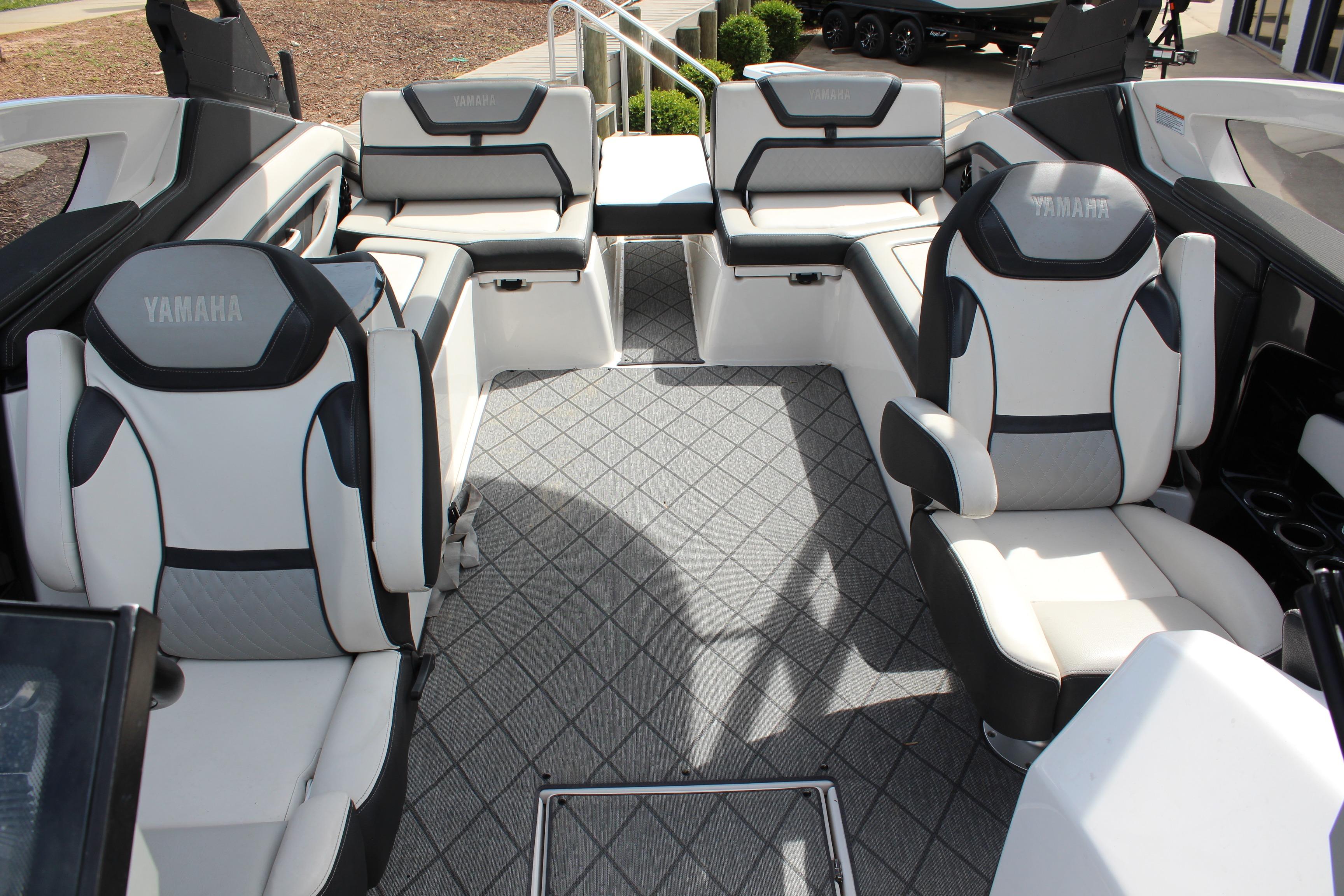 Interior of 2020 Yamaha Boats 275SE, featuring luxurious seating and modern design.