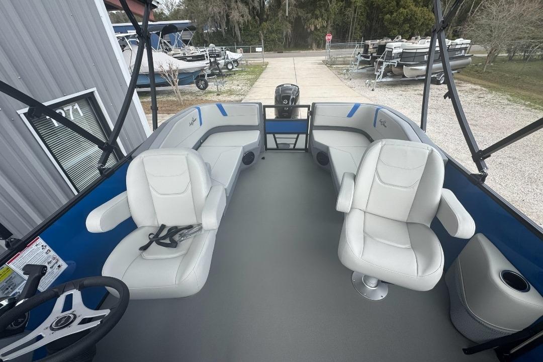 2026 SunChaser Lucerne 20 LR DH pontoon boat interior with white seating and steering wheel.